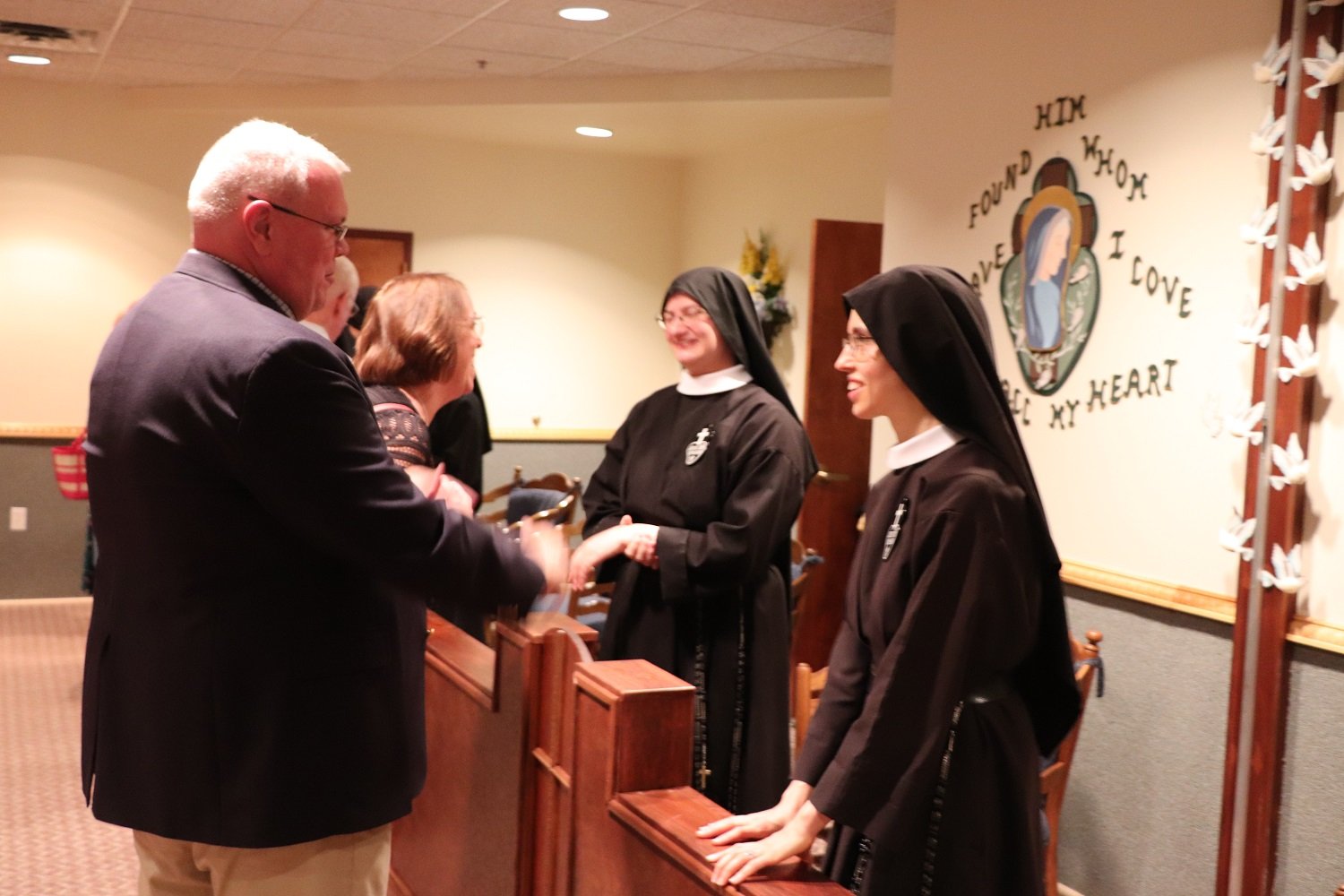  Sisters Mary Andrea and Miriam Esther speak with Postulant Hannah’s parents, Joe and Cathy 