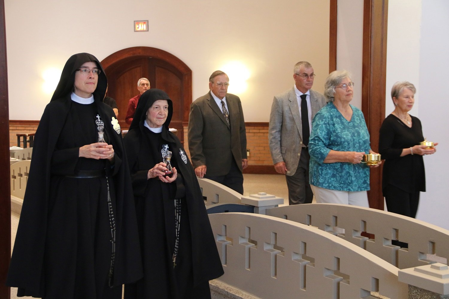  For the Offertory procession, Mother was joined by Sr. Mary Agnes (who, as Superior, received her vows 25 years ago), as well as her parents and godparents   (photo credit: Elizabeth Wong Barnstead, Western KY Catholic)  