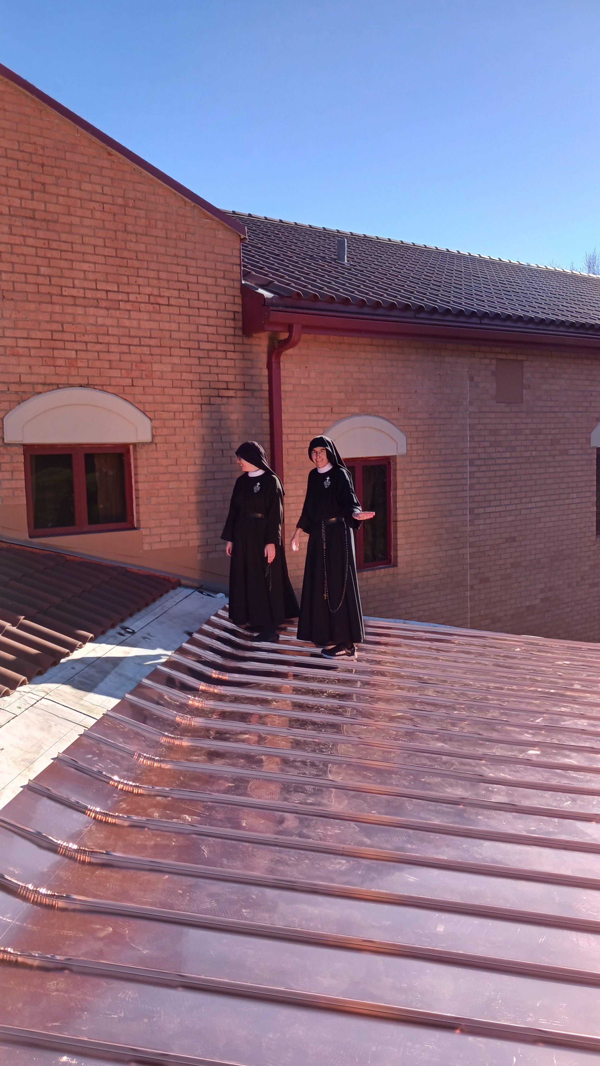  Mother John Mary and Sr. Maria Faustina both agree: that’s one shiny roof! 