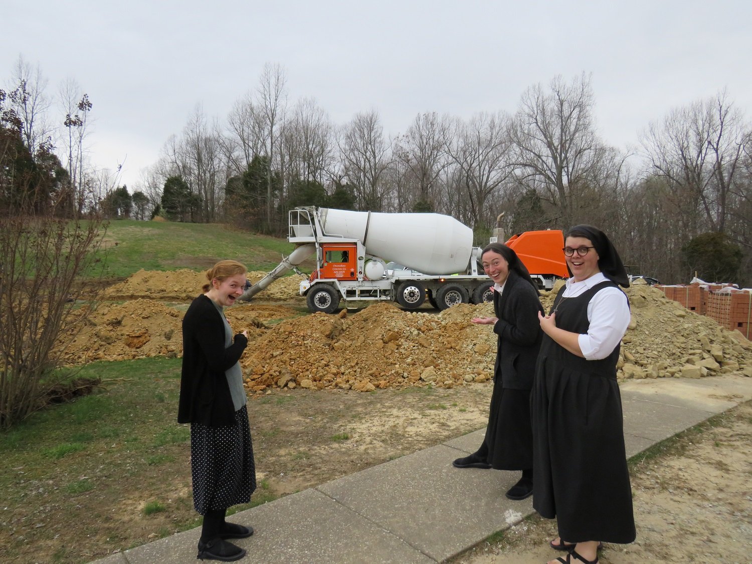  Aspirant Emma and Postulants Holly and Hannah are very happy to see that concrete truck! 