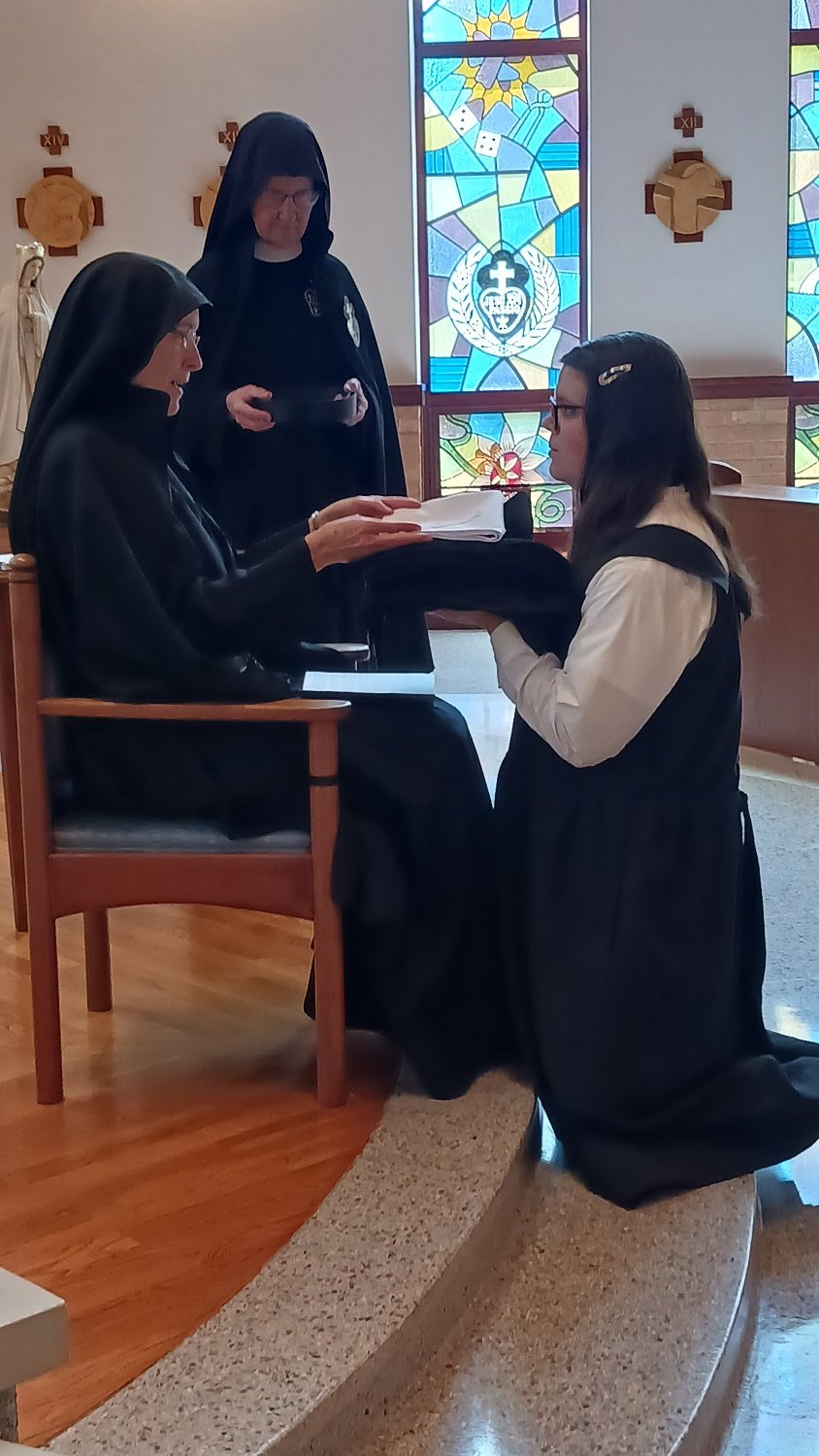  Hannah receives the holy habit, piece by piece, from Mother John Mary. 