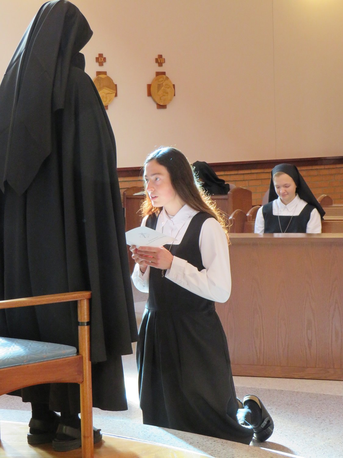  Holly kneels before Mother John Mary to make her request to enter the novitiate 