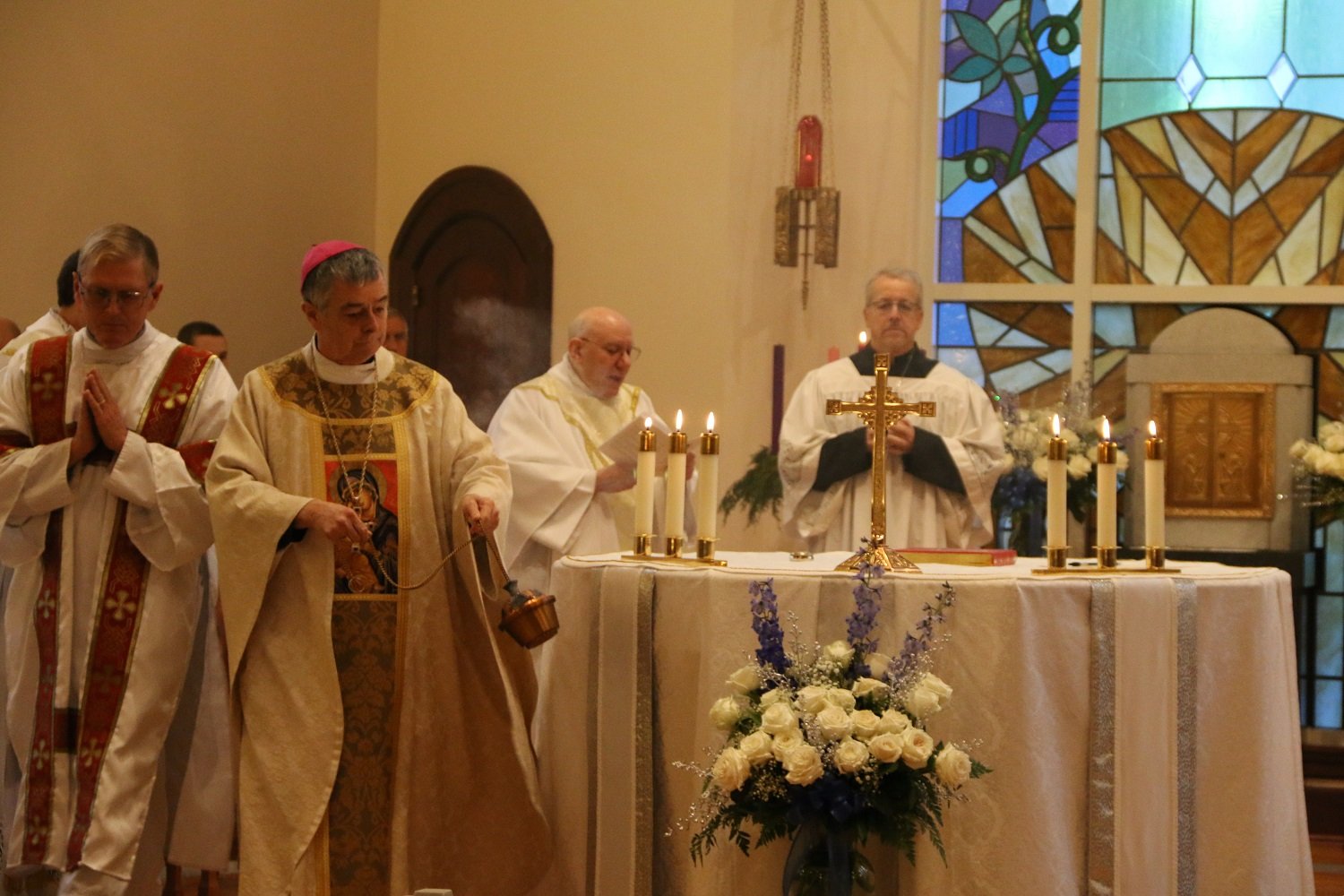  Bishop Medley incenses the altar   (Photo: Elizabeth Wong Barnstead, Western KY Catholic)  