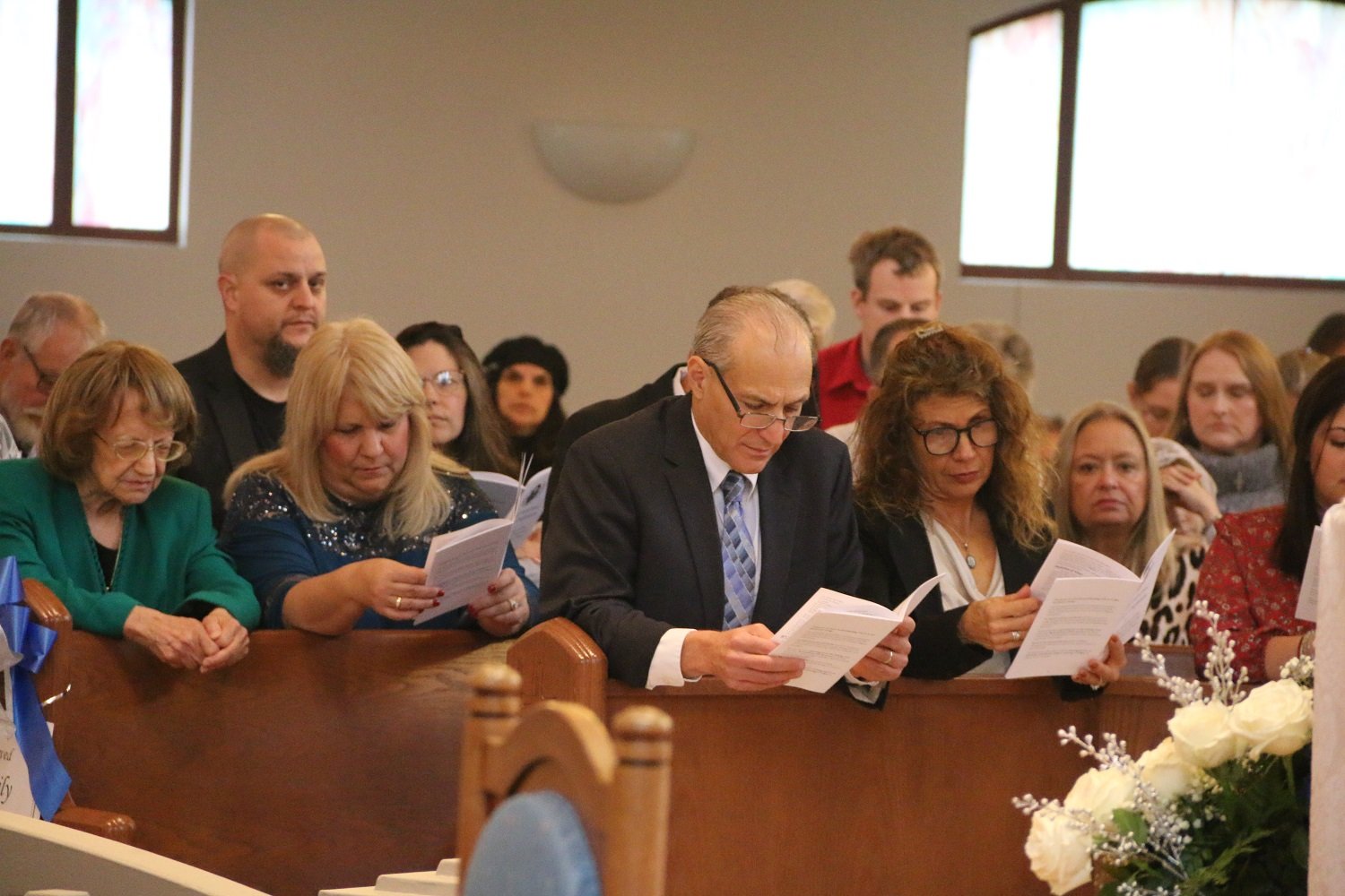  Sister’s family, joining in as the Litany of Saints is sung during the prostration.   (Photo: Elizabeth Wong Barnstead, Western KY Catholic)  