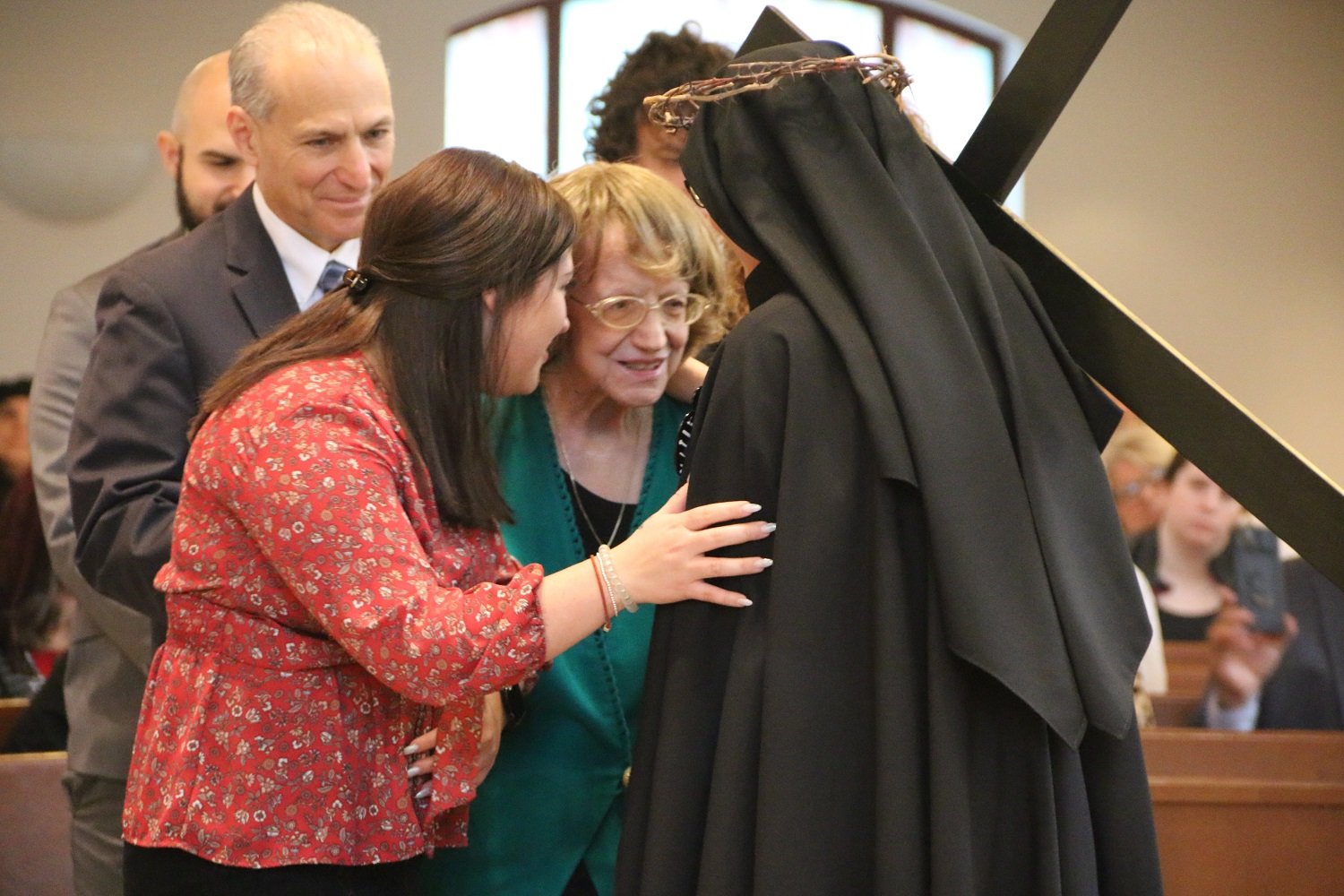  Sister’s grandmother Joan traveled to make a surprise appearance at the Profession Mass! She is accompanied here by Regina, the girlfriend of Sr. Maria Faustina’s brother Shane.   (Photo: Elizabeth Wong Barnstead, Western KY Catholic)  