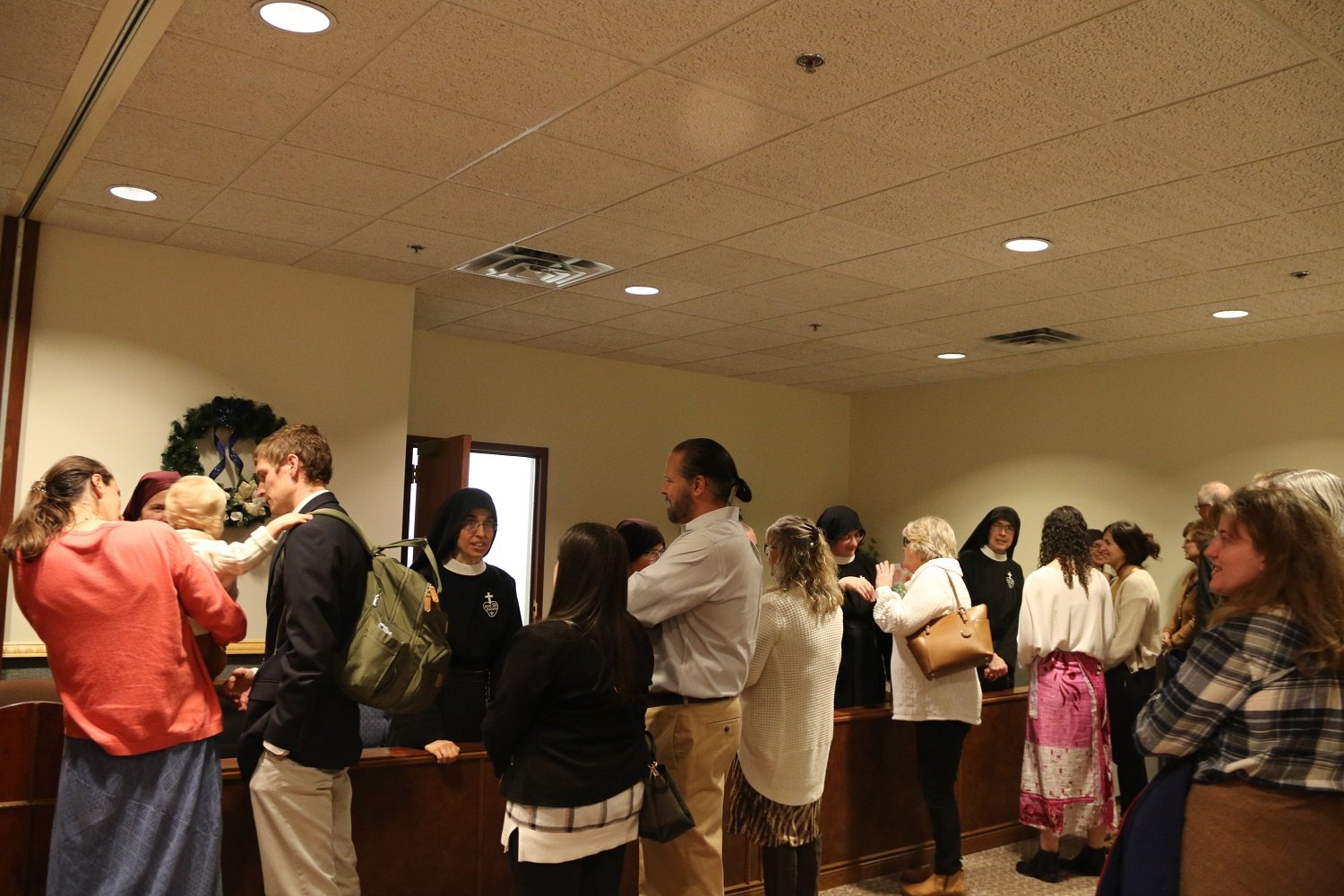  The receiving line after Mass seemed to stretch for miles!   (Photo: Elizabeth Wong Barnstead, Western KY Catholic)  