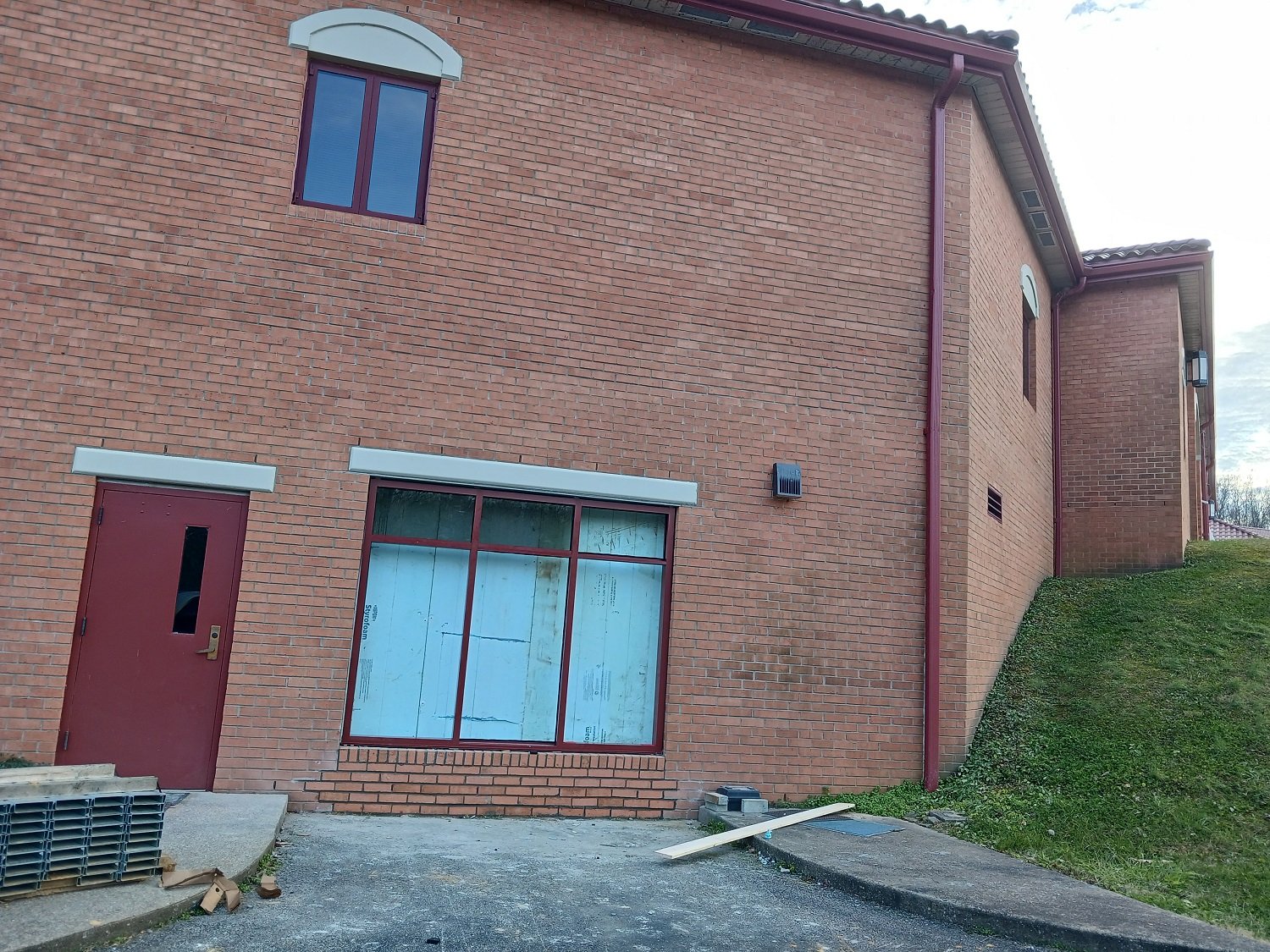  The garage beneath the Retreat House is being converted into a spiritual direction/meeting room, entitled Our Lady of Holy Hope Room. Seen here: the garage door has been removed and the picture window installed. Blue insulation is keeping the pipes 