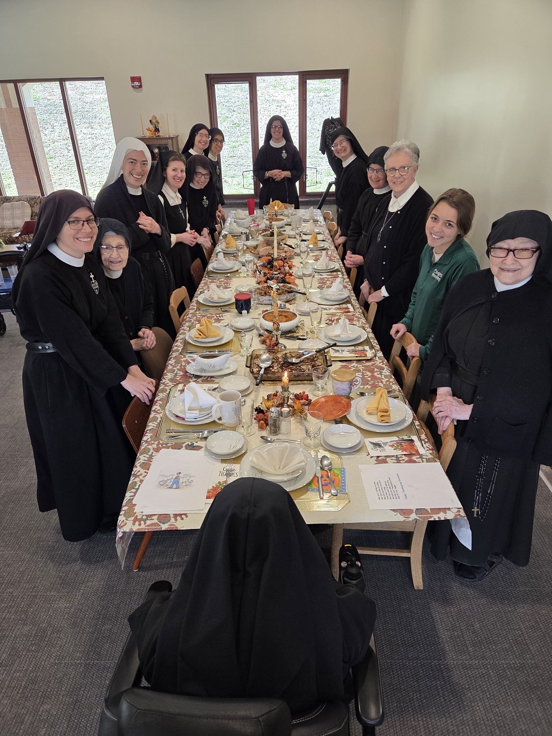 Gathered around our Thanksgiving table in the Holy Family Wing recreation room 