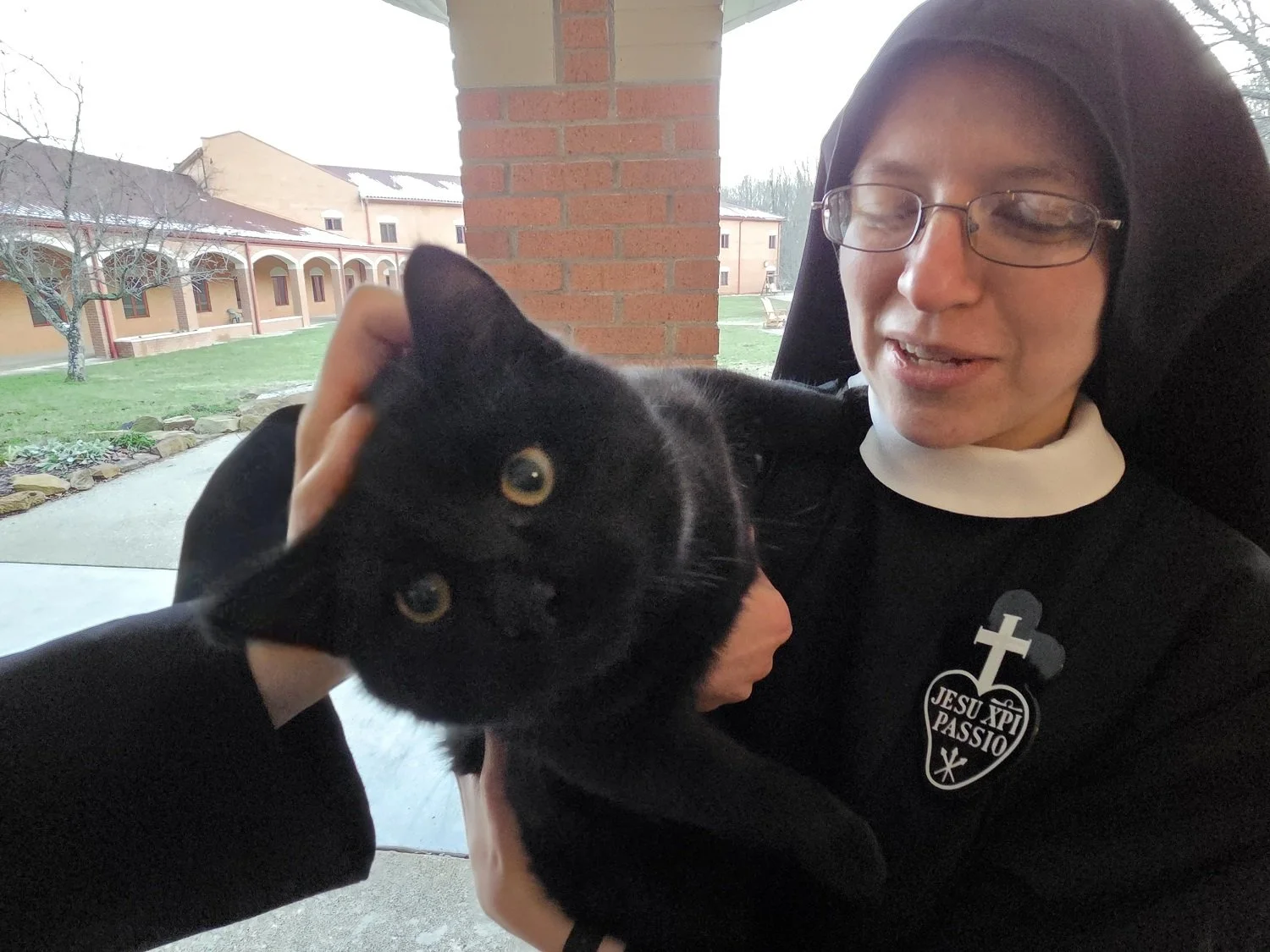  Sometimes Nico likes to cuddle … other times, like here with Sr. Frances Marie, he’s a handful! 