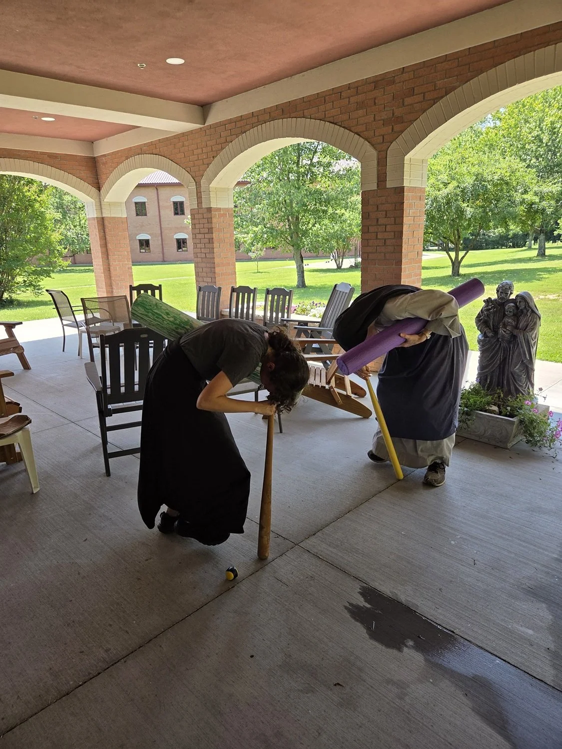  Aspirant Morgan and Sr. Isabel Maria initiate the relay race by twirling around a bat… 