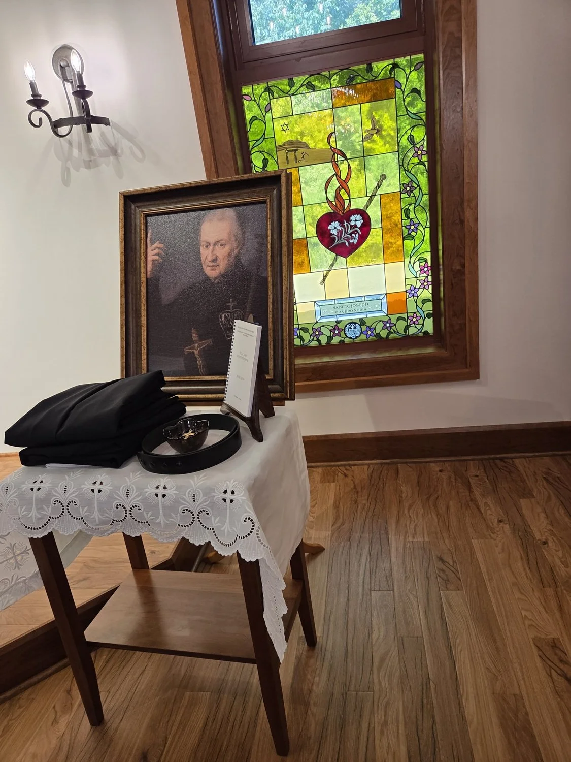  Our Holy Founder watches over the habit and Rule soon to be presented to the new novice 
