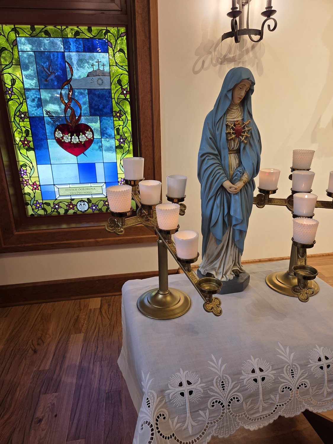  Each Sister placed a votive light next to Our Sorrowful Mother, with space in the center for the soon-to-be novice’s candle 