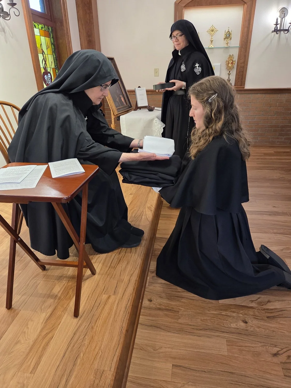  Collette receives the holy habit, piece by piece, from Mother Mary Veronica 