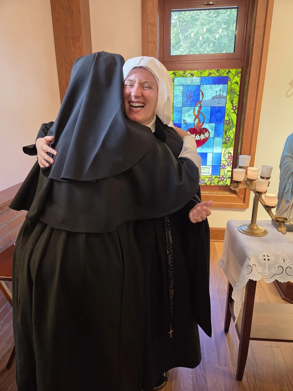  A special hug from Sister’s novitiate companion, Postulant Noelle 