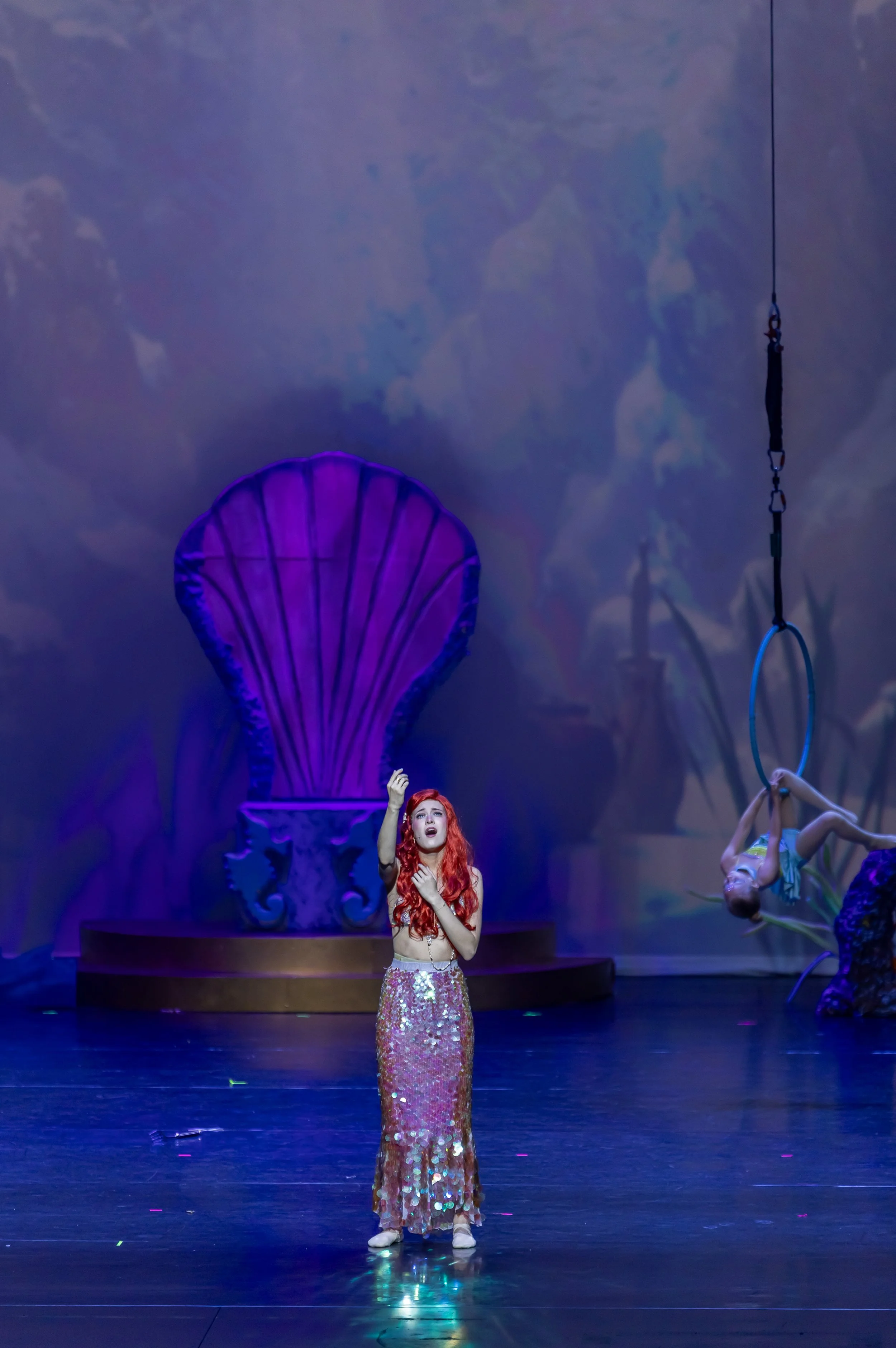 Showcasing the professional set design and lighting that defined the immersive world of the production.