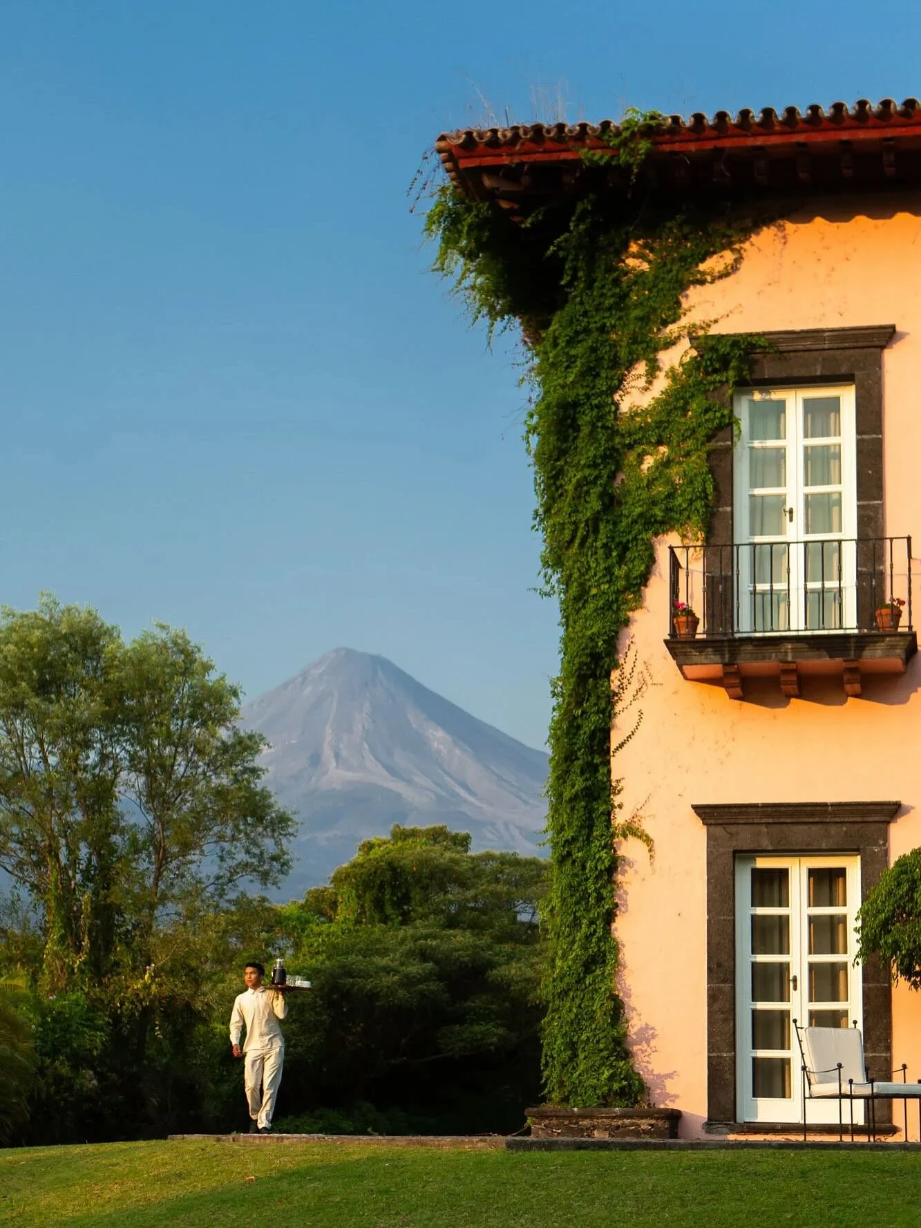 Located at the foothills of Volcano of Colima, in the picturesque highlands of Mexico, is the captivating Hacienda de San Antonio. Surrounded by gardens, volcanic vistas, and its own organic farm, every detail is curated for a private, immersive esca