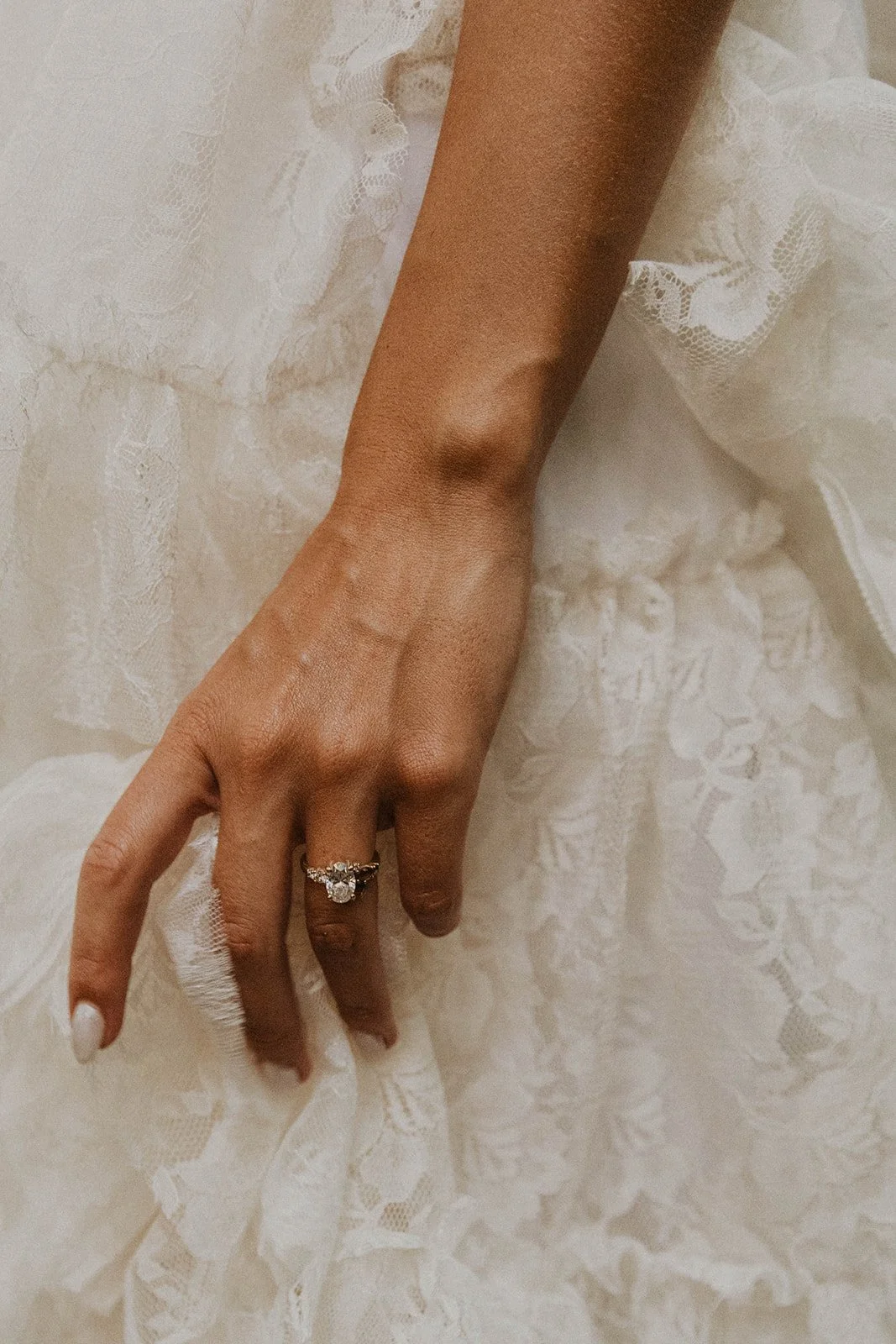 Close-up of bride hand showing engagement ring wedding day