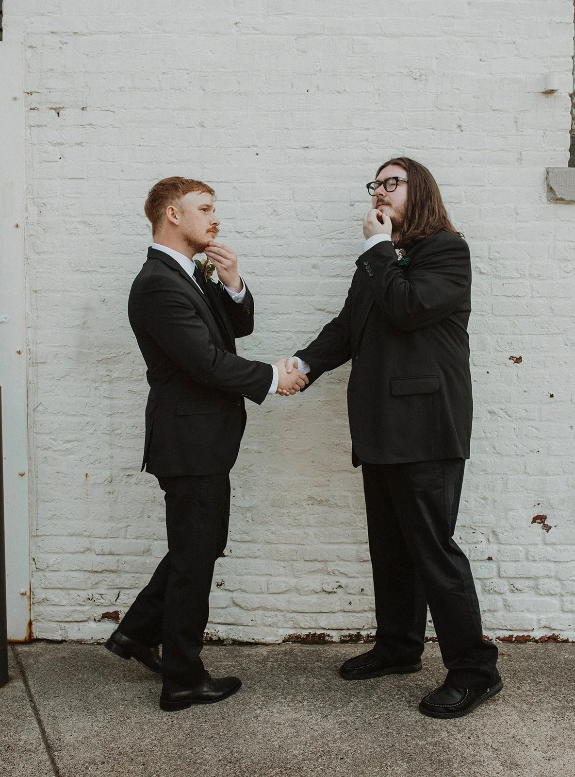 Groom and groomsman share a playful portrait moment before a Castaway Portland wedding