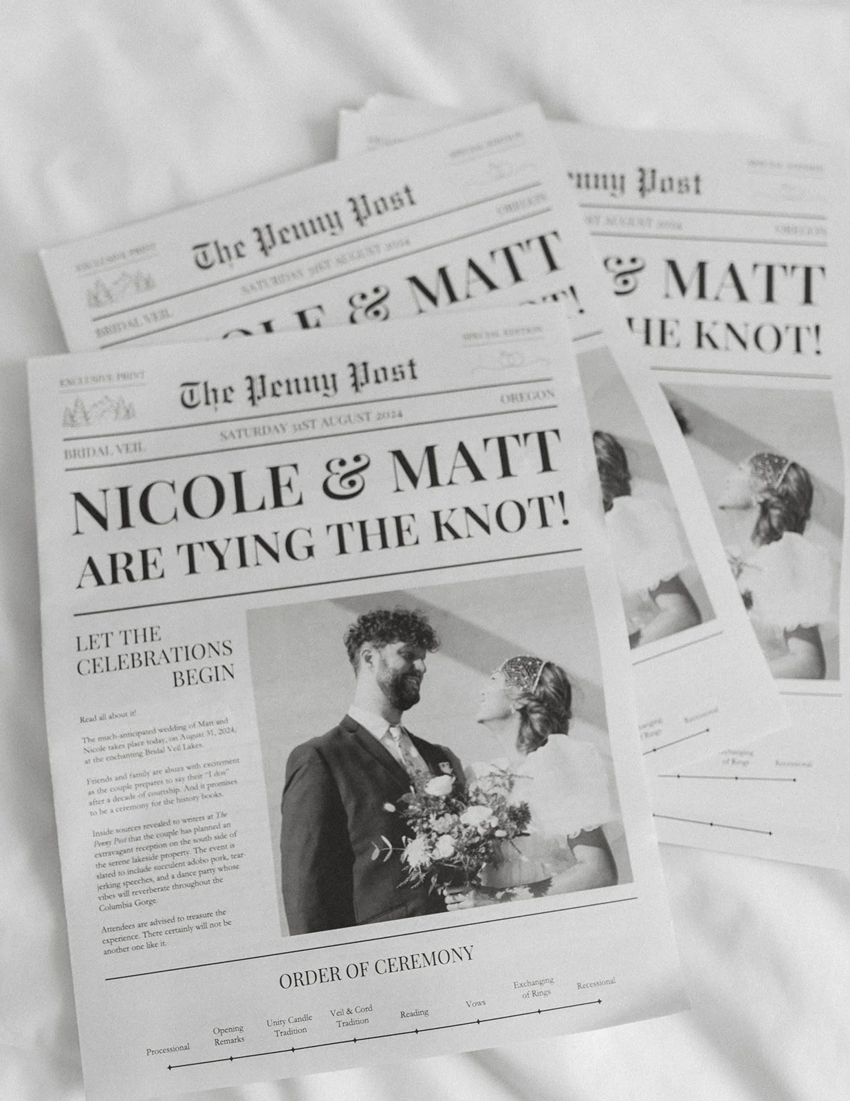 Custom wedding newspaper program featuring the couple's story and ceremony details displayed before the ceremony at Bridal Veil Lakes.