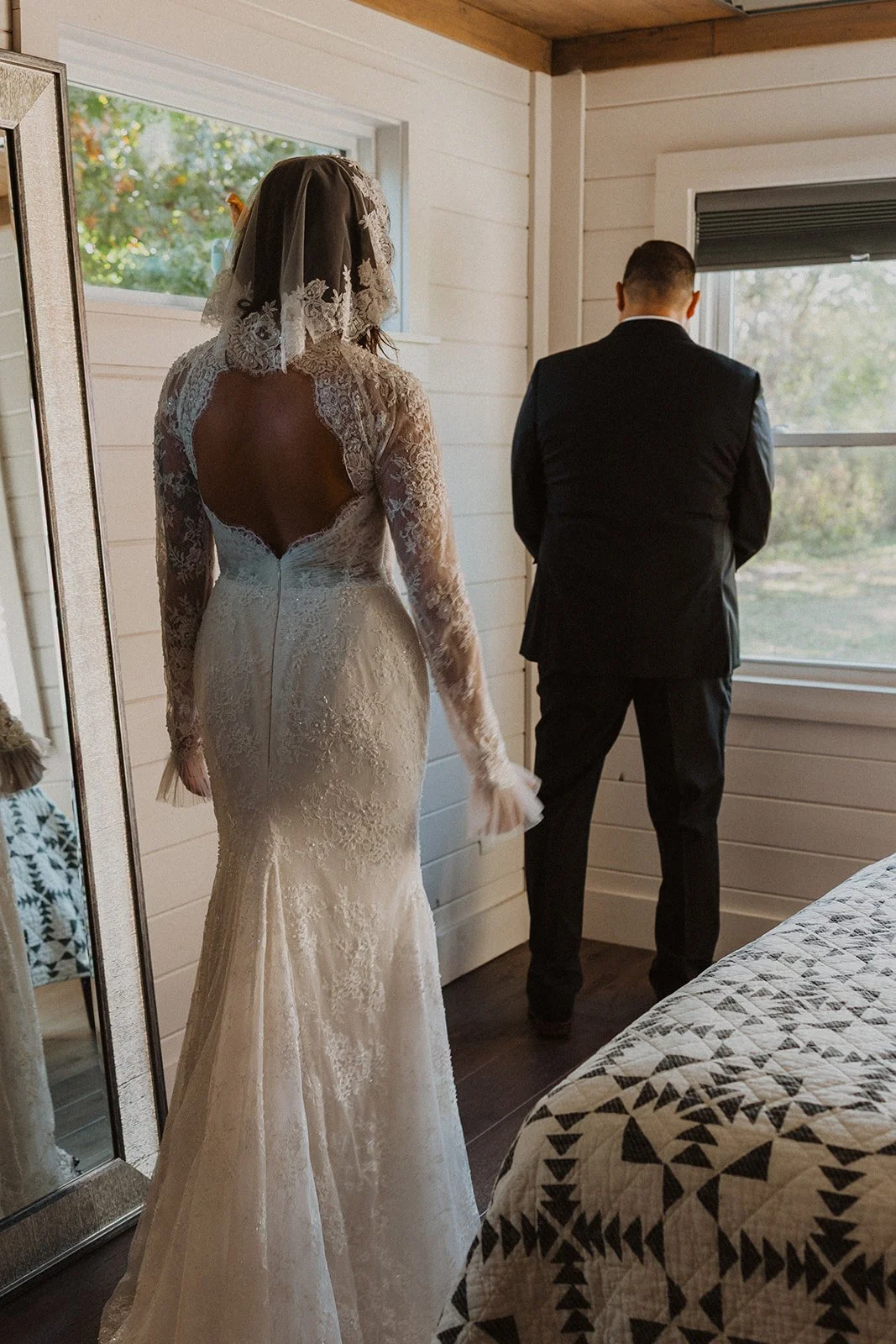 Bride approaching her father from behind before their emotional first look inside the getting-ready suite at Bright Morning Farm.