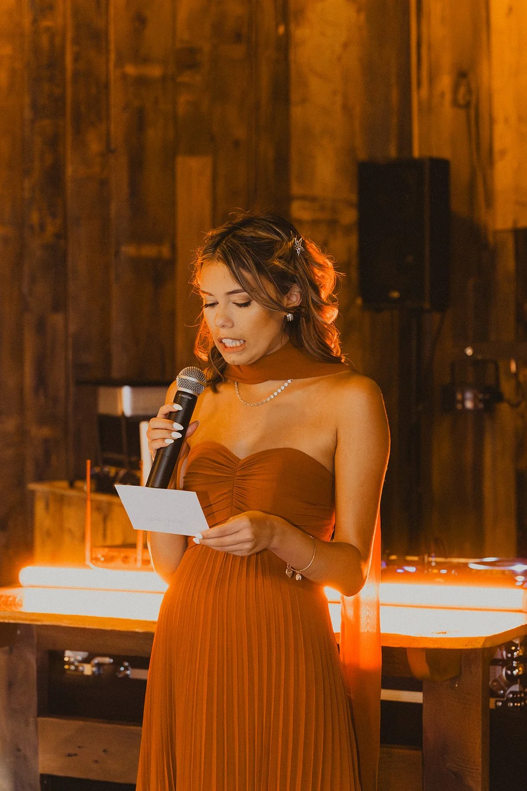 Bridesmaid giving a heartfelt toast during the wedding reception at Bright Morning Farm.