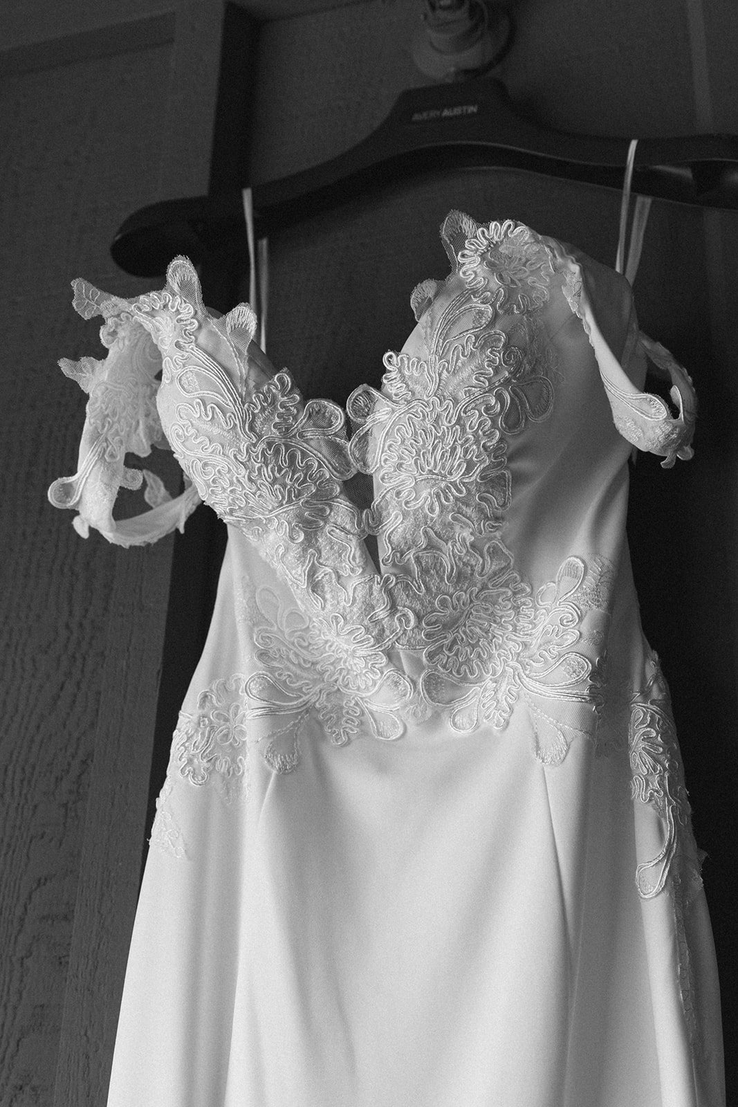 Lace wedding dress hanging before the ceremony at Skamania Lodge.