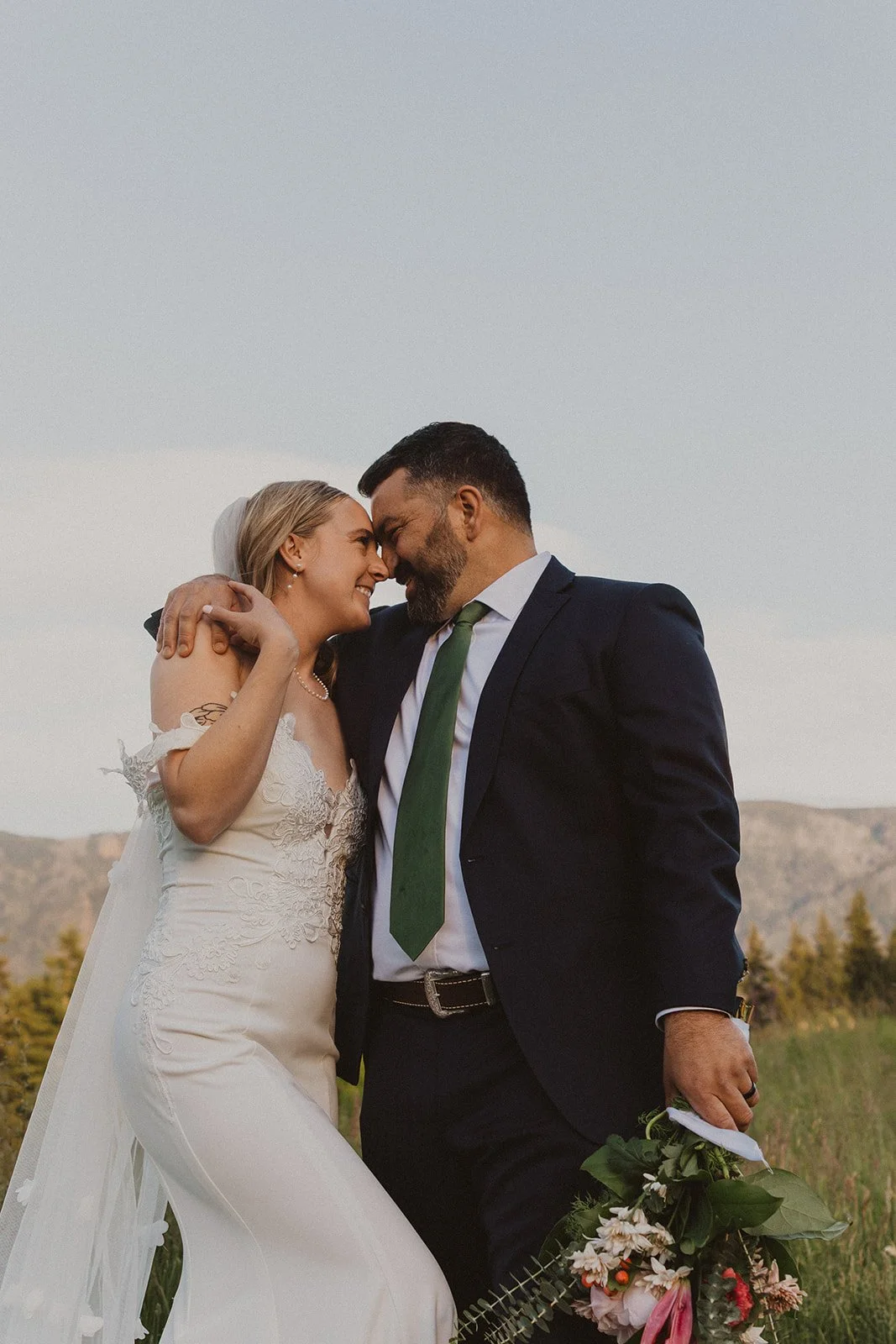 Close-up portrait of newlyweds smiling together during golden hour at Skamania Lodge.