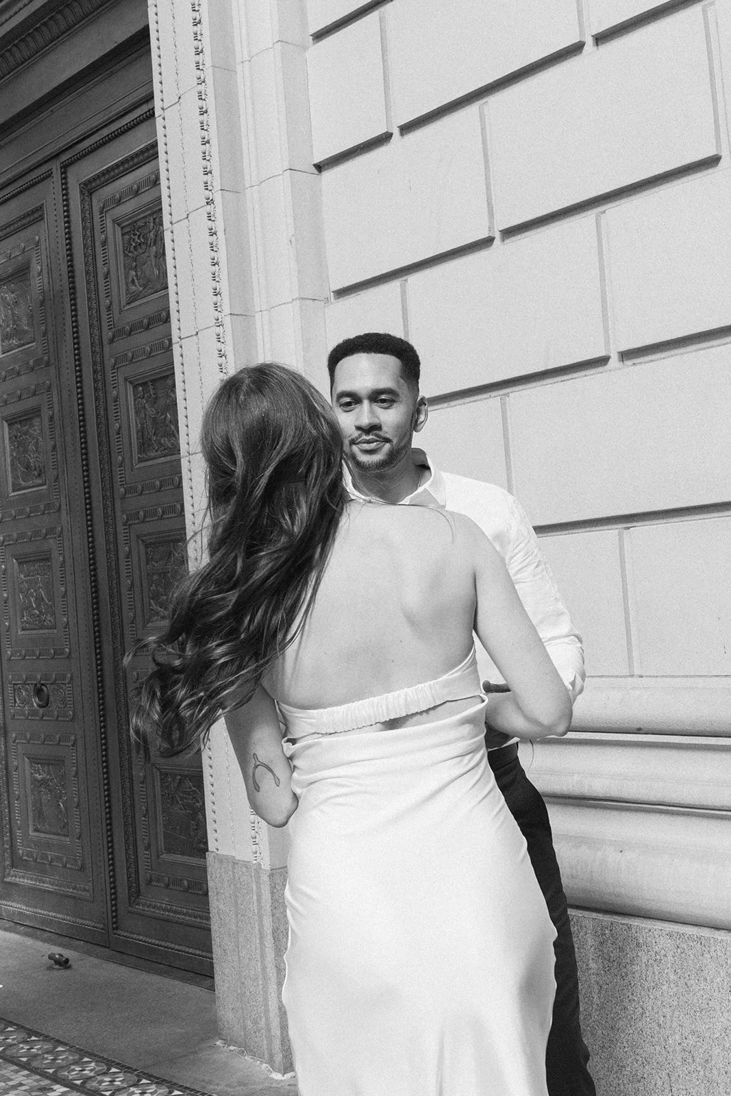 Couple walking through downtown Portland during their engagement session