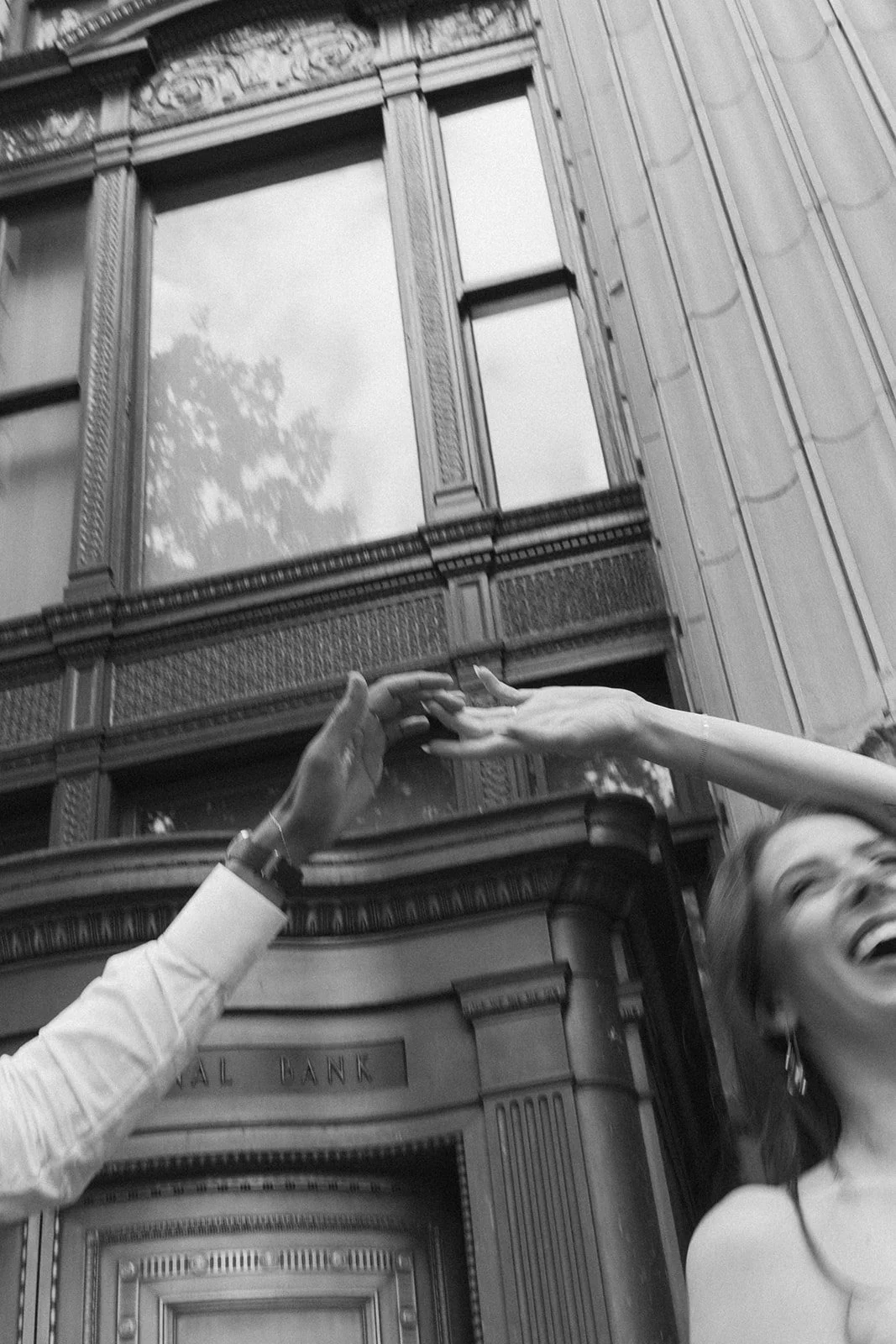 Couple dancing during their dressed-up city engagement session in Portland