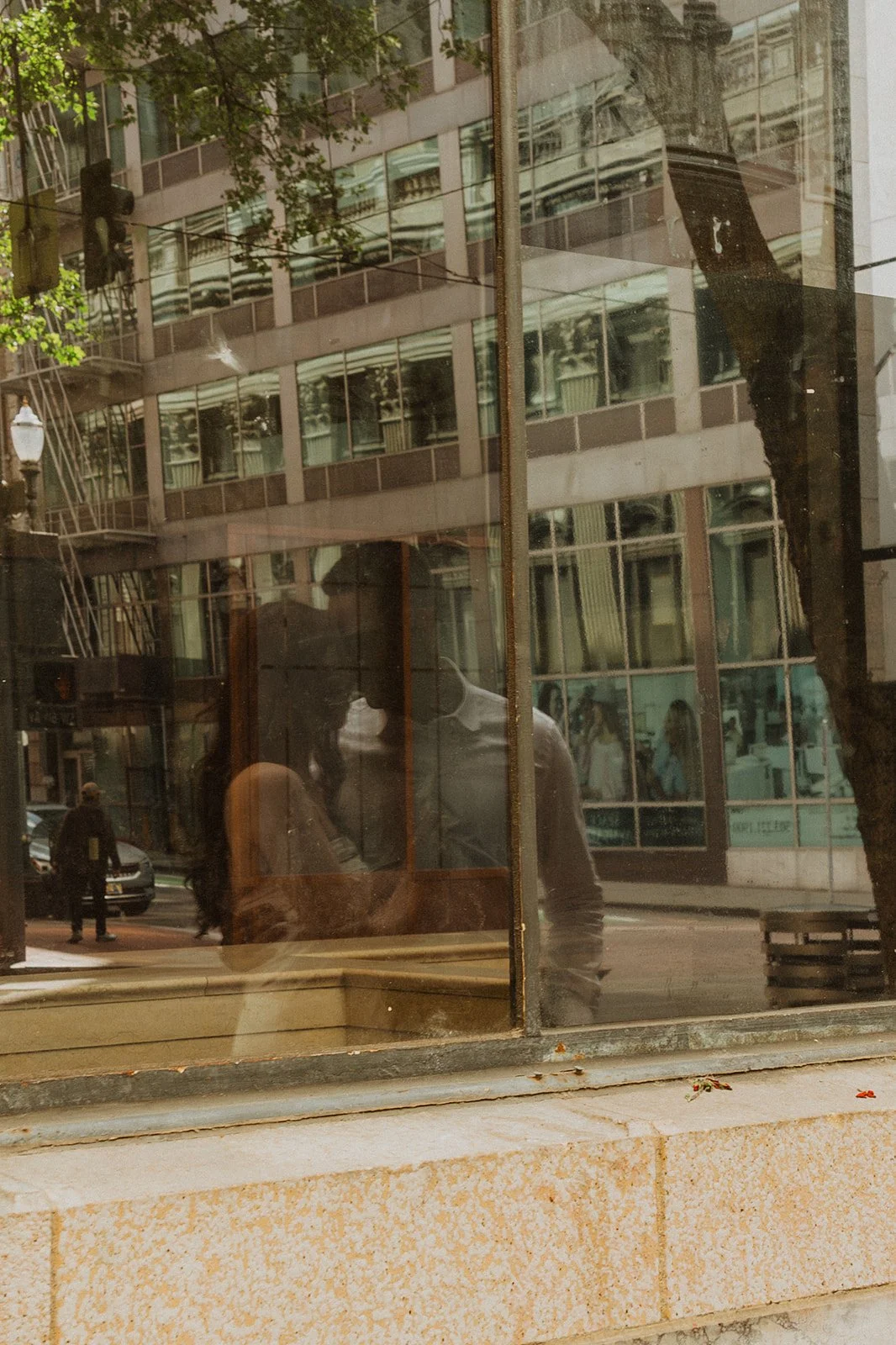 Charlotte and Lucas dressed up and exploring Portland for their engagement photos