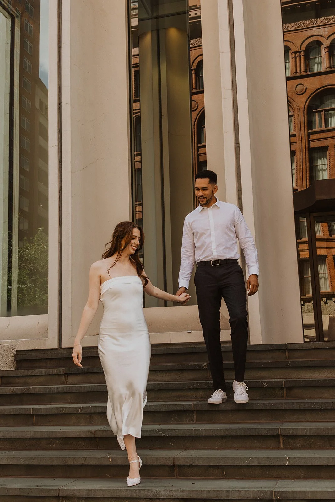 Couple enjoying a date-like engagement session in downtown Portland