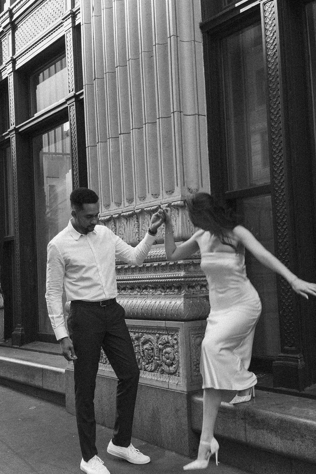 Couple enjoying a date-like engagement session in downtown Portland