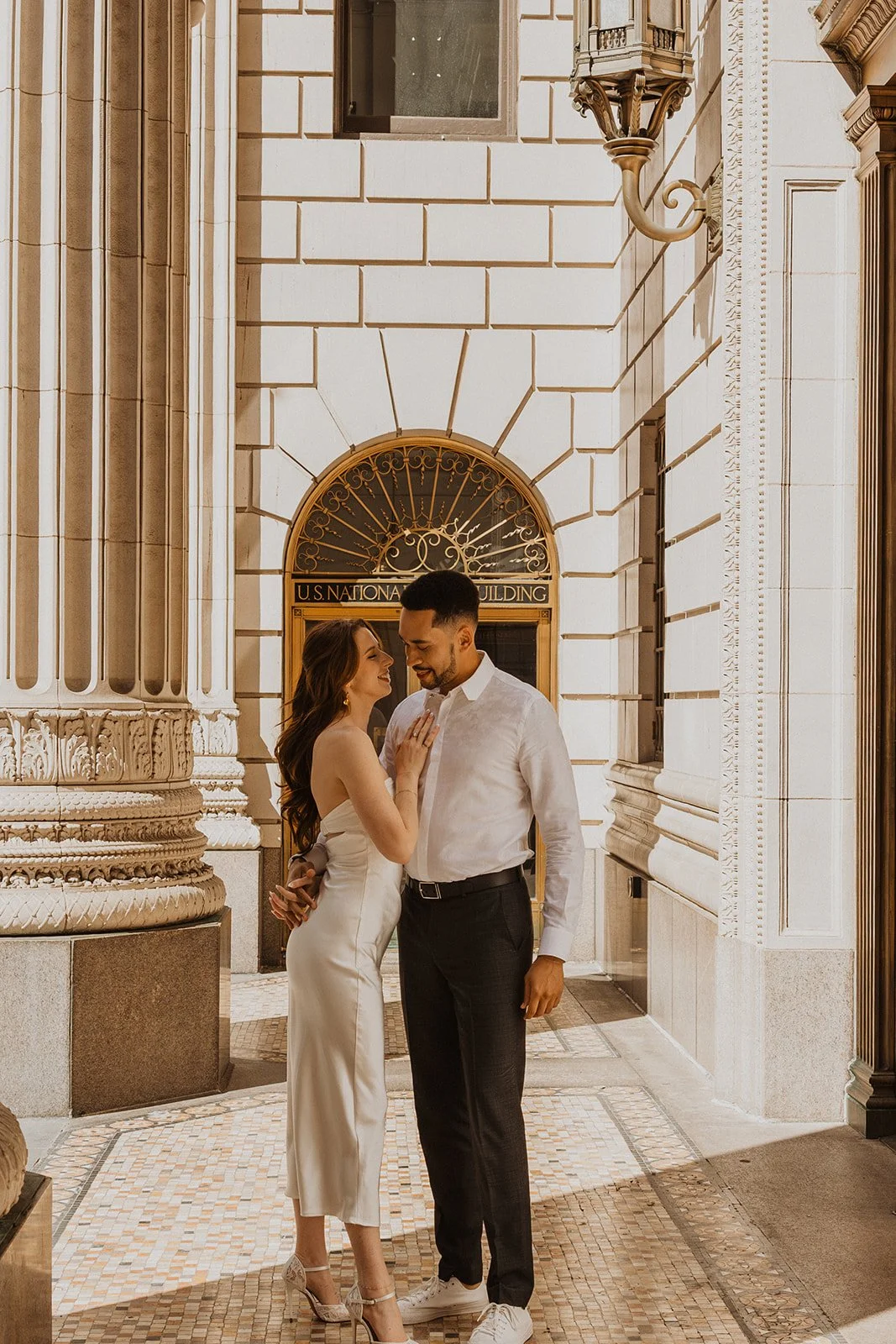 Couple having fun together during their downtown Portland engagement session
