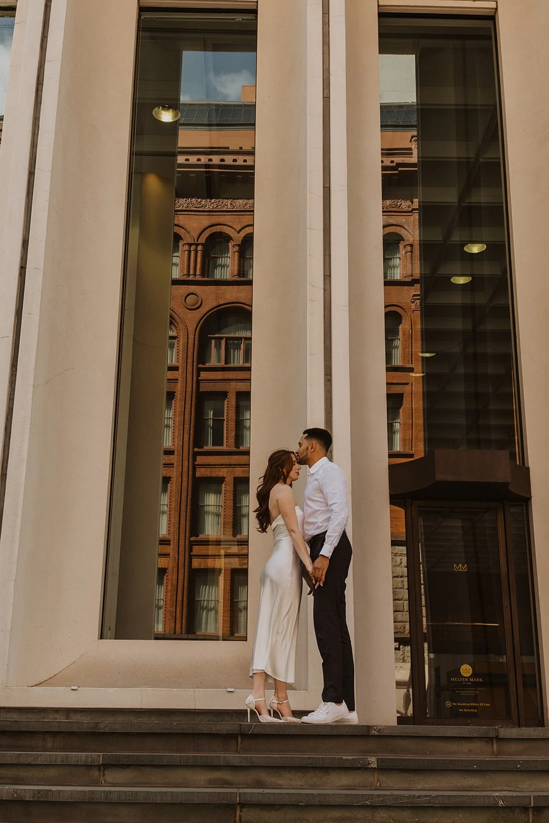 Couple running together during a relaxed downtown Portland engagement session