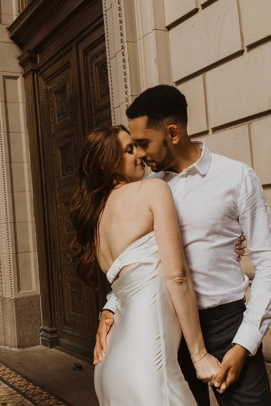 Charlotte and Lucas surrounded by the urban setting of downtown Portland