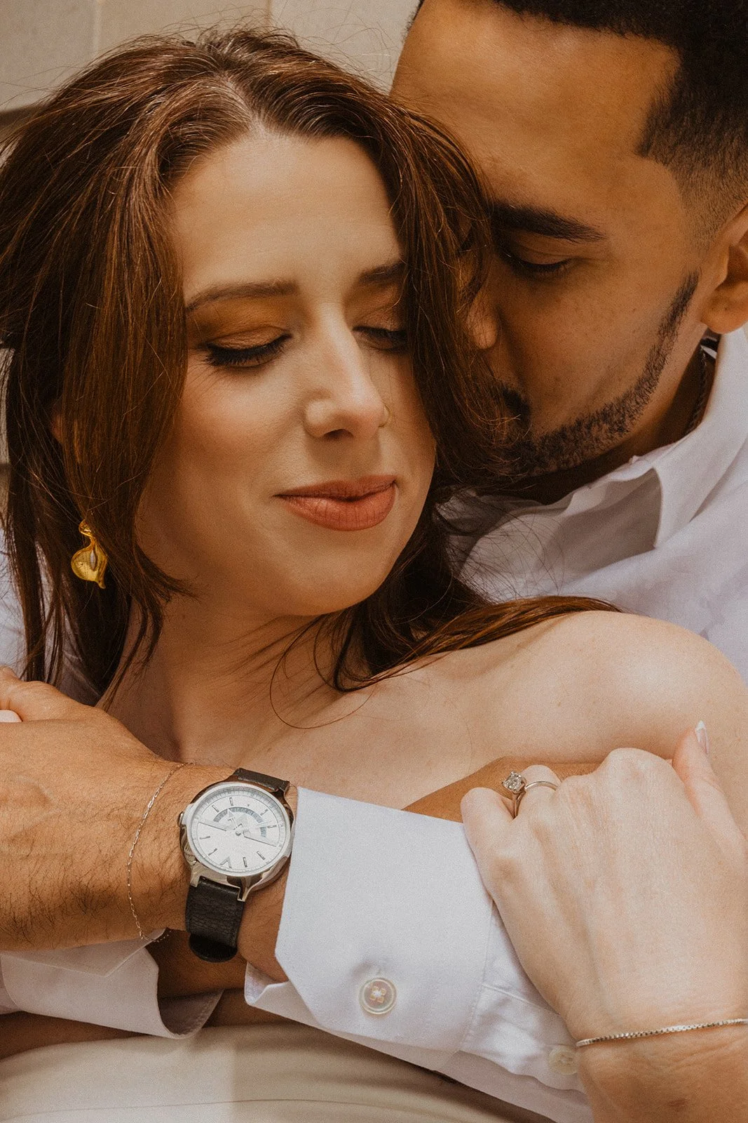 Charlotte and Lucas photographed among downtown Portland buildings during their engagement session