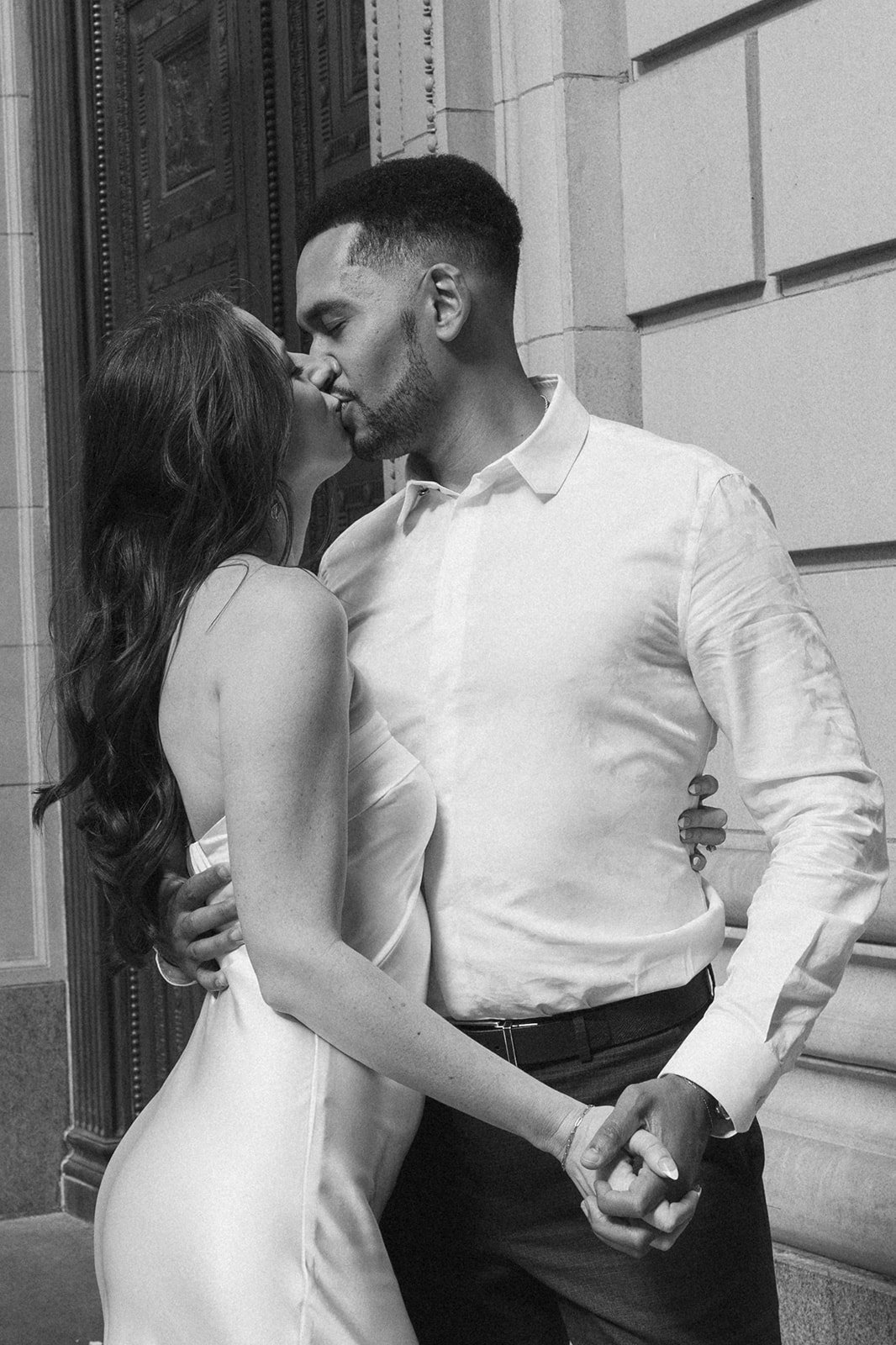 Charlotte and Lucas walking together on a downtown Portland sidewalk