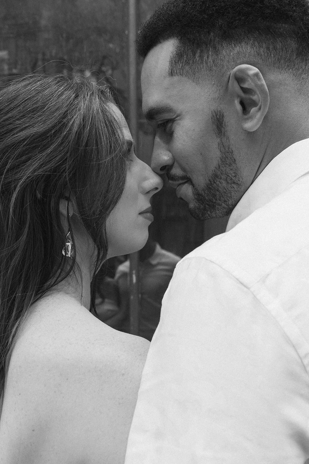 Candid moment between Charlotte and Lucas on a downtown Portland street