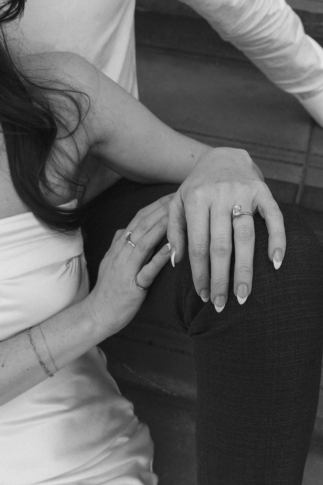 Couple engagement ring photographed in the middle of downtown Portland for their city engagement session
