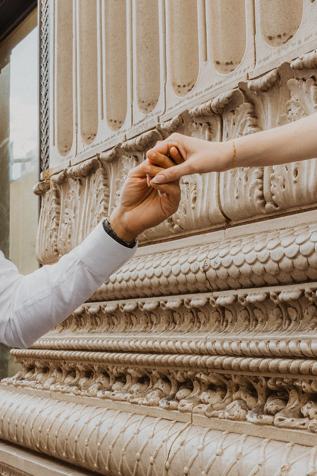 Candid engagement portrait of Charlotte and Lucas in downtown Portland