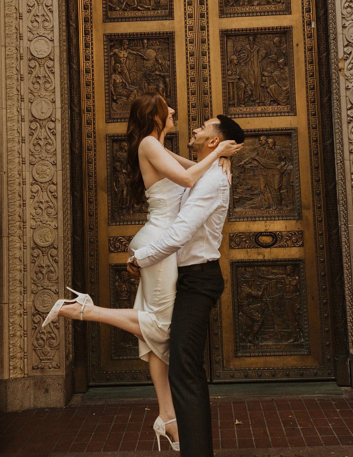 Couple exploring downtown Portland during their engagement session