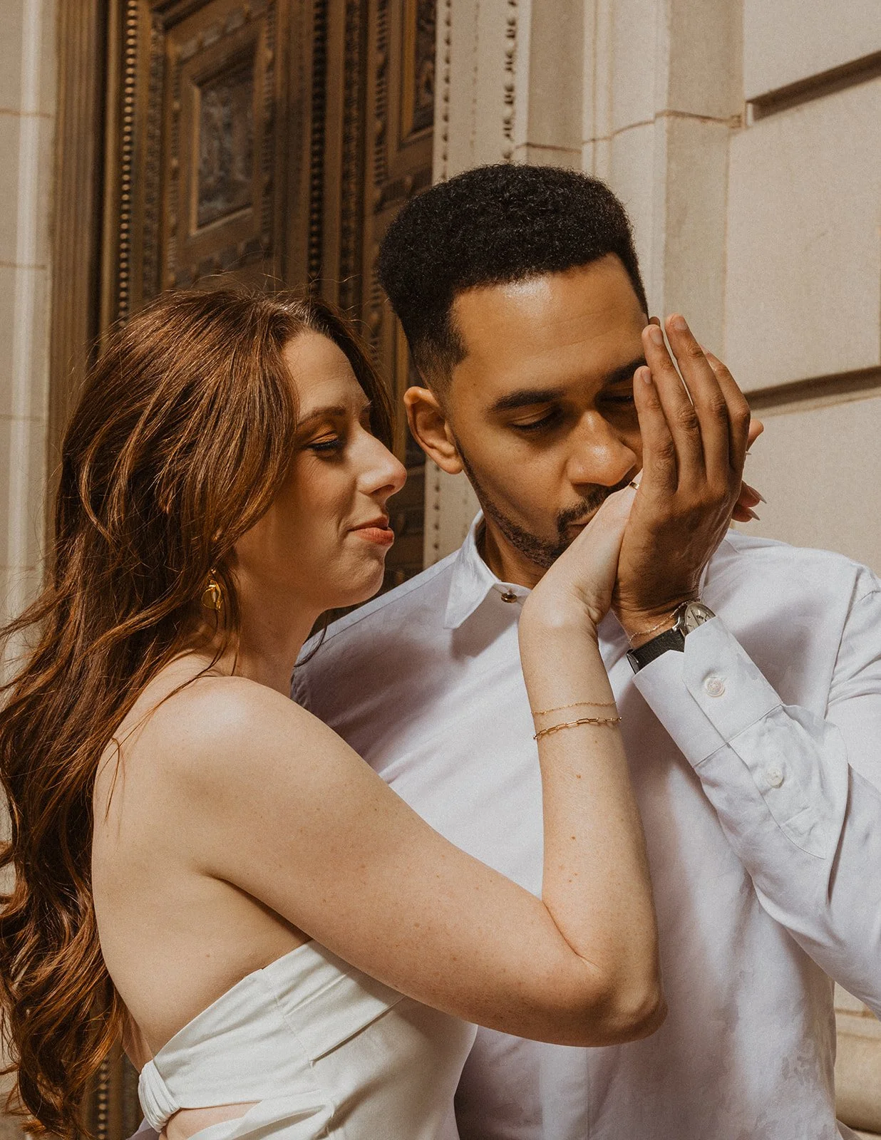 Sweet moment between couple during their urban engagement session in Portland, Oregon
