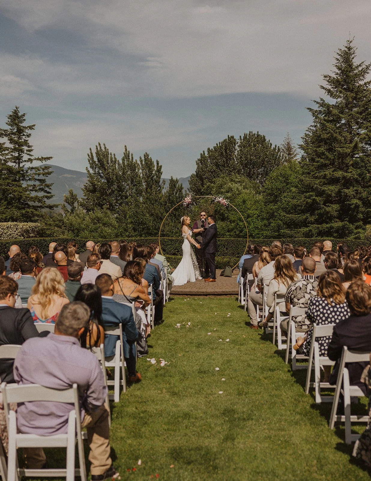 Only a dozen chairs, set close for an intimate outdoor ceremony