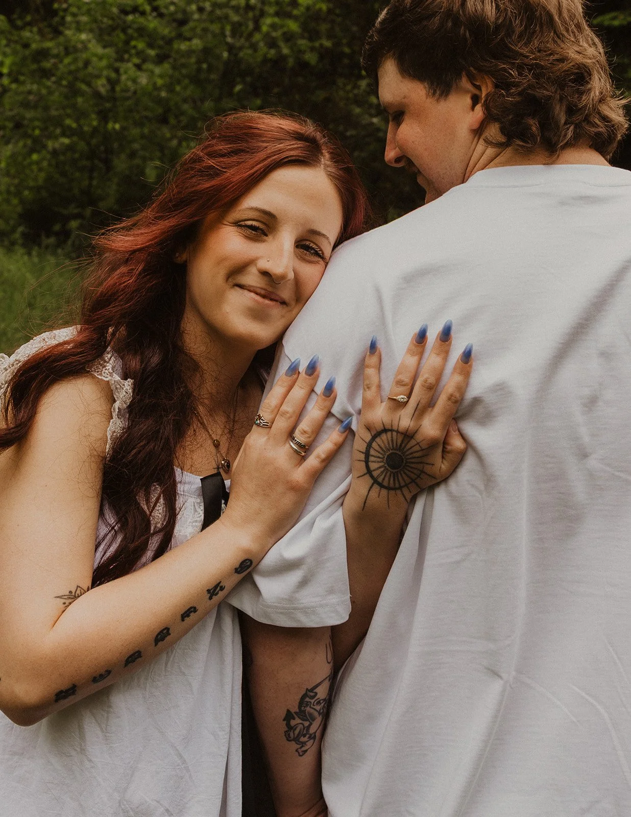 Holding onto each other over uneven tree roots on the trail
