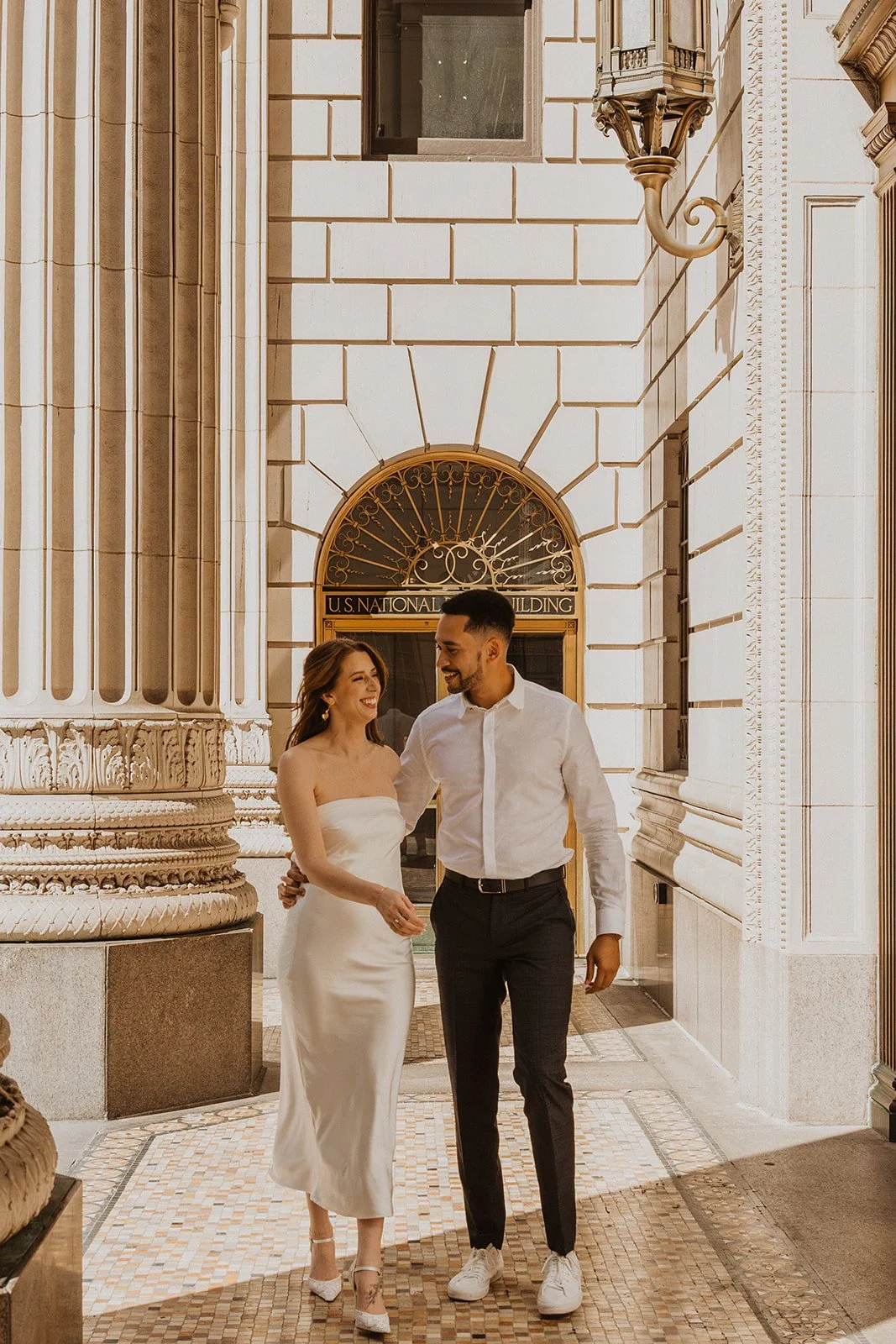 Holding hands through a downtown Portland intersection, not waiting for it to clear