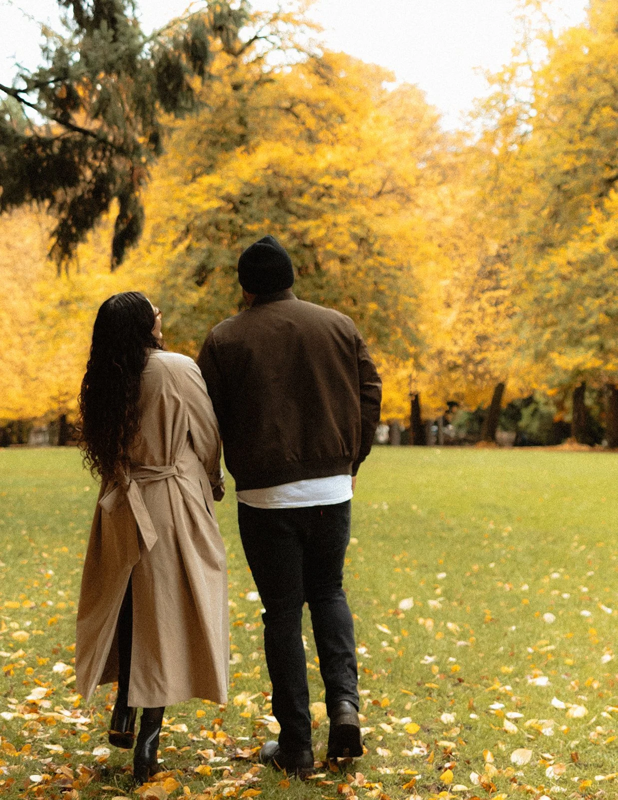 Couple walking toward each other across the open lawn