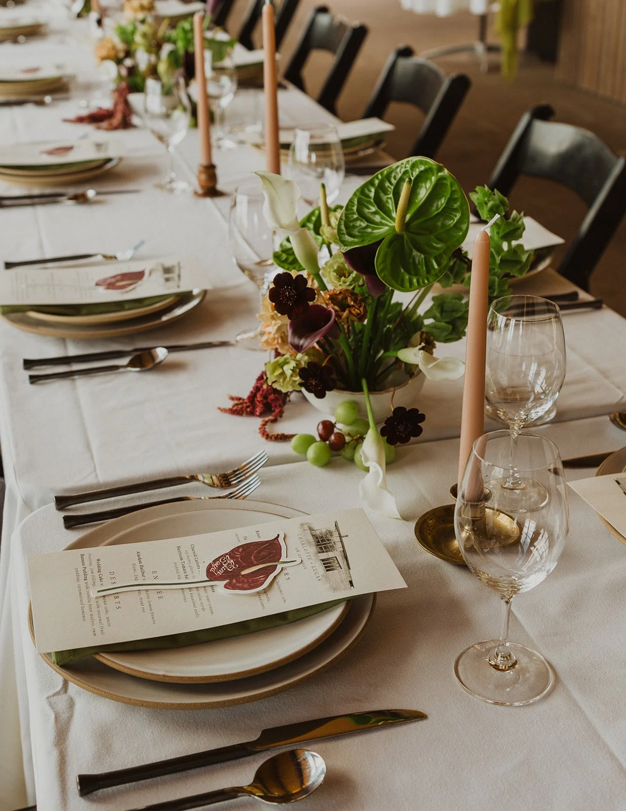 One long dinner table set for forty at an Oregon winery wedding