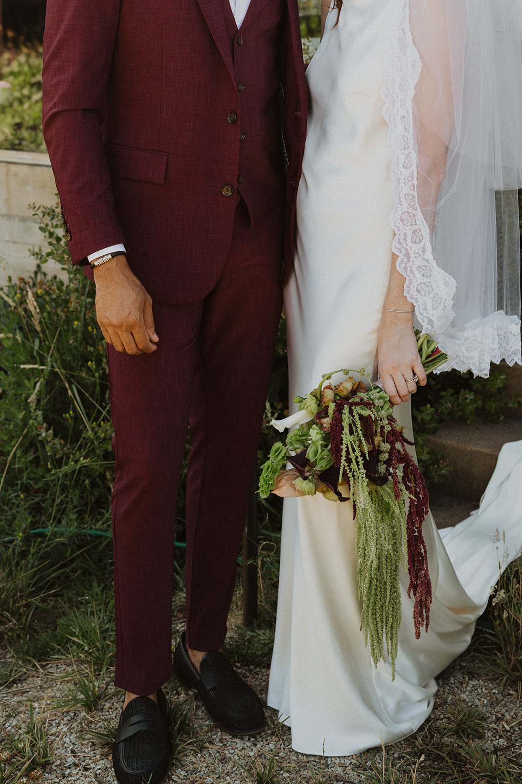 Portraits taken in the rows during an Oregon vineyard wedding