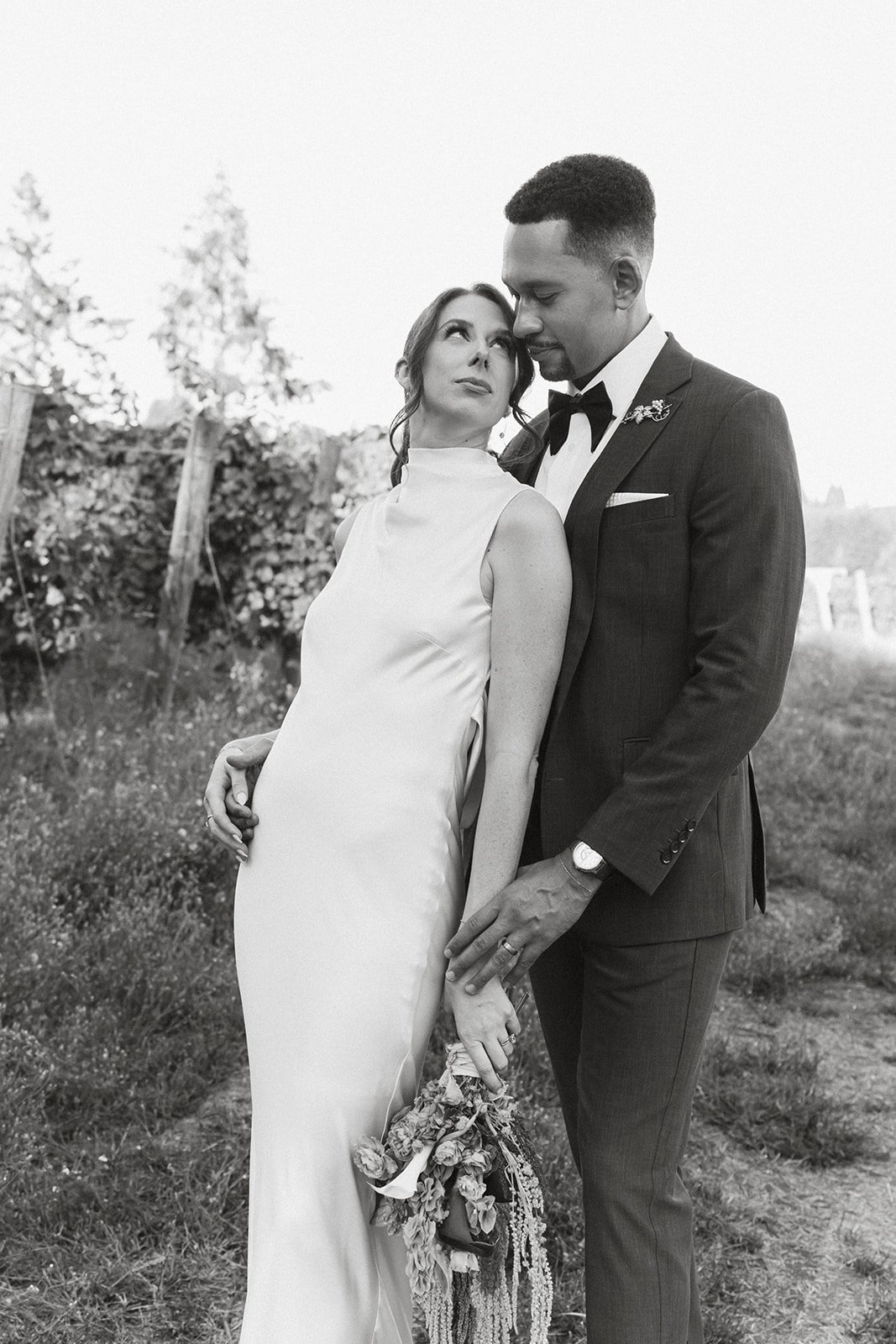 Valley and mountains behind a couple at an Oregon winery wedding