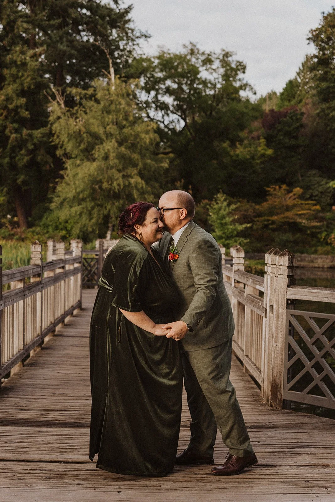 Kissing on the footbridge above the spring fed lake at Crystal Springs
